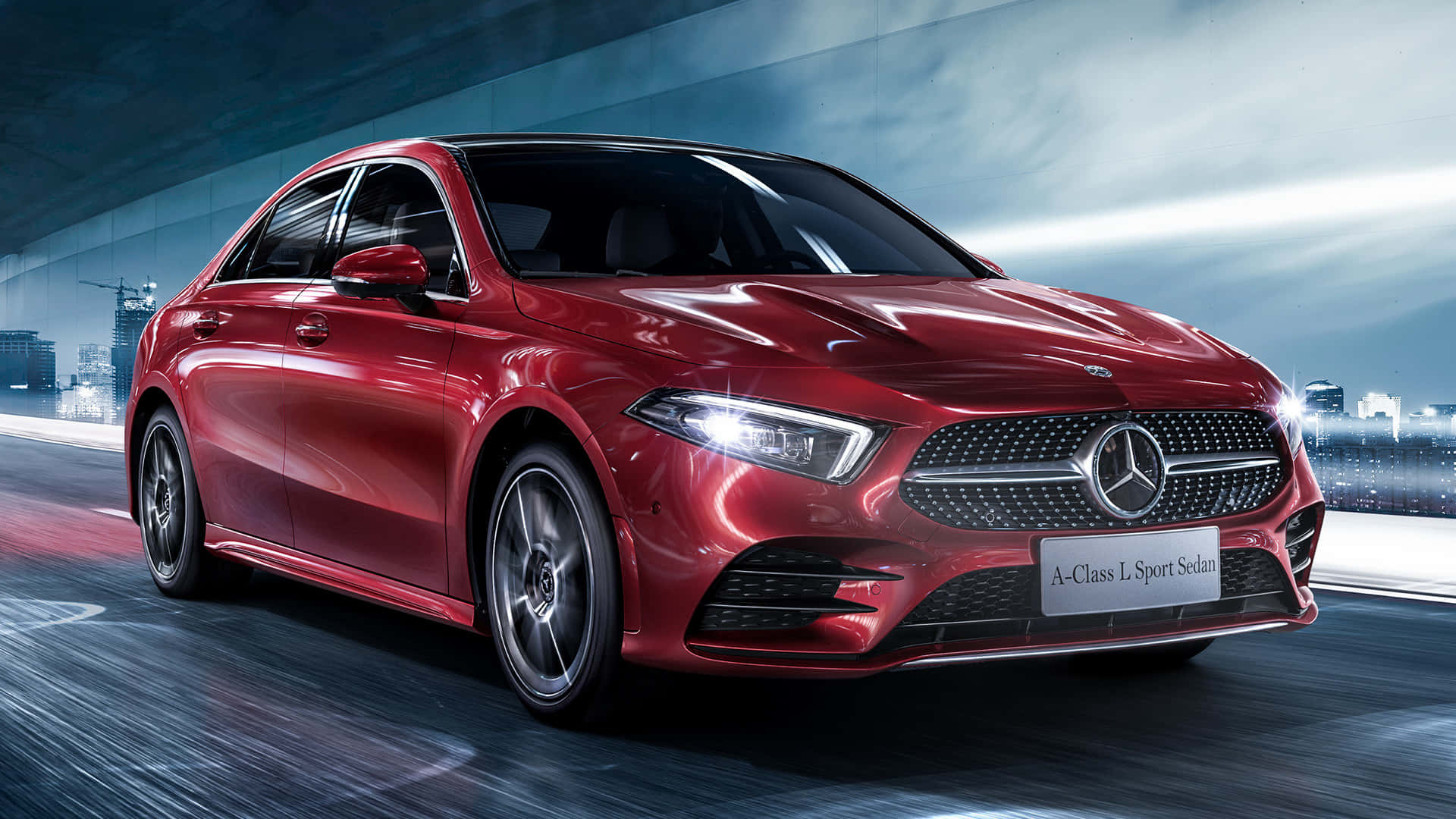 Mercedes Benz A-class 桌布 壁紙 — 一輛時尚的紅色 Mercedes A-Class L Sport Sedan 在充滿發光燈光和模糊動感的未來城市隧道中飛馳。