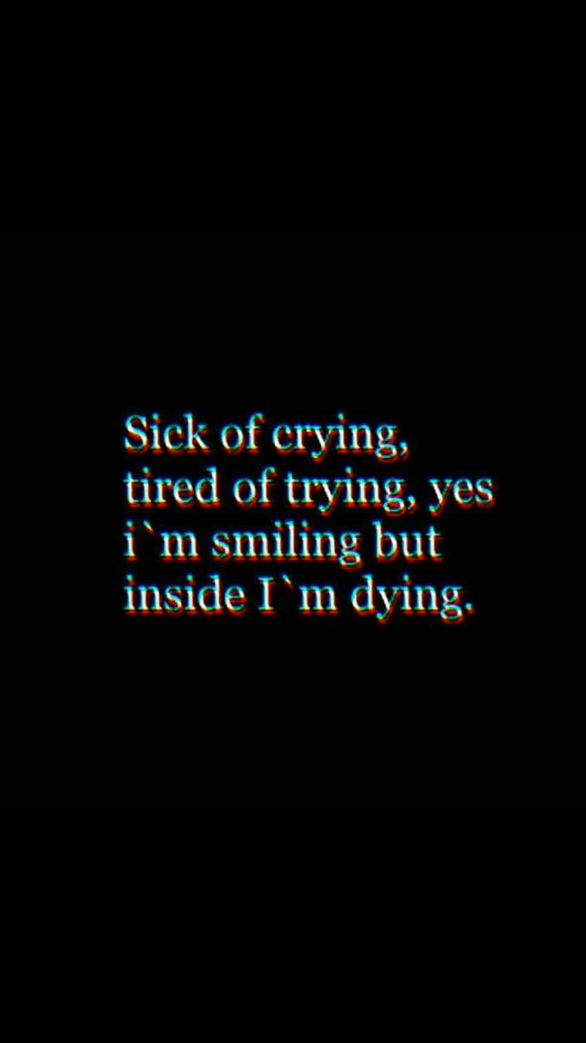  壁紙 — 文字疊加顯示「Sick of crying tired of trying yes i'm smiling but inside I'm dying」，以故障風紅藍字體呈現於黑色背景上。