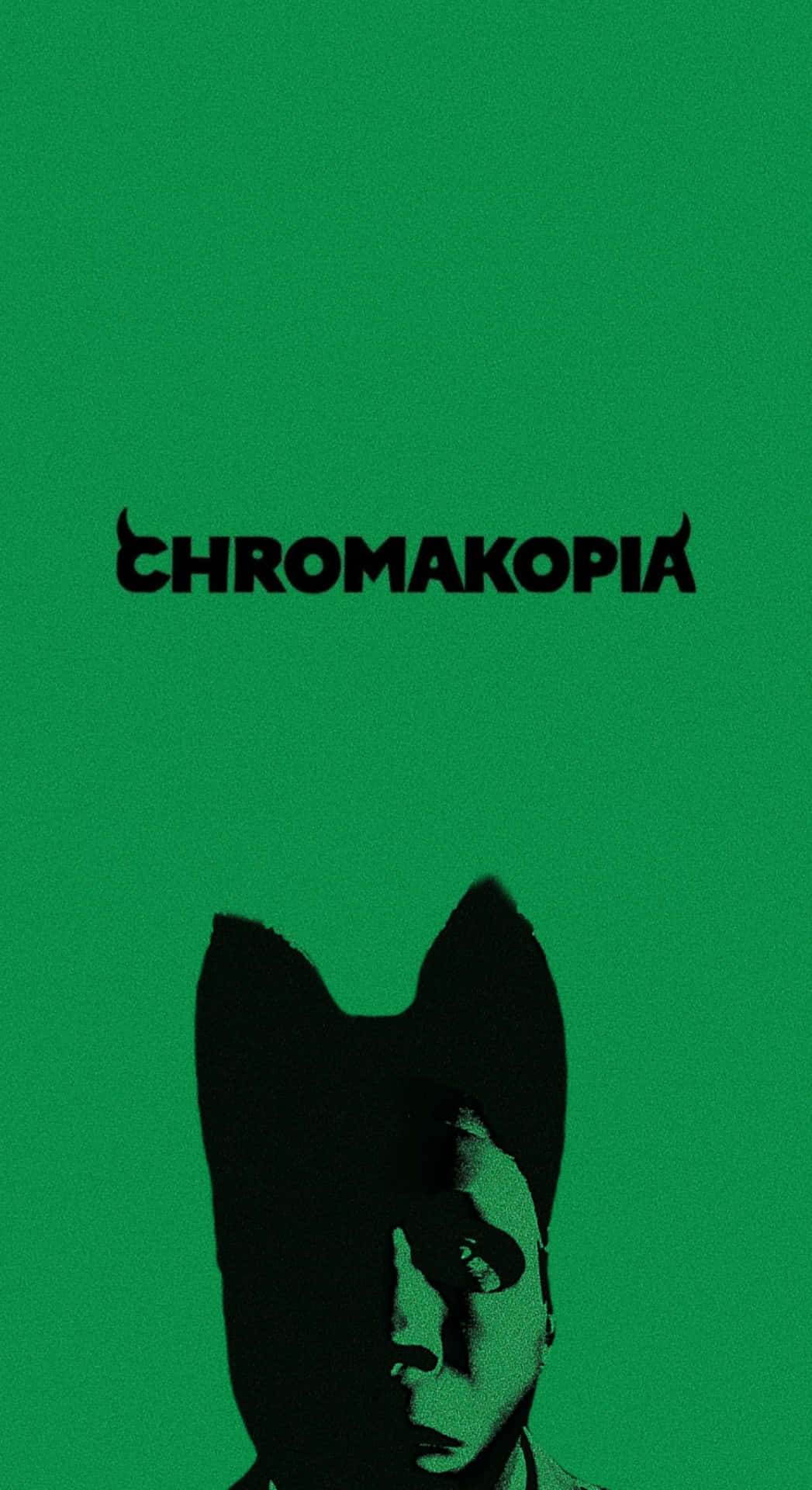  壁紙 — 鮮綠色背景上有一個戴貓耳的人的黑色剪影，上方有「CHROMAKOPIA」字樣。