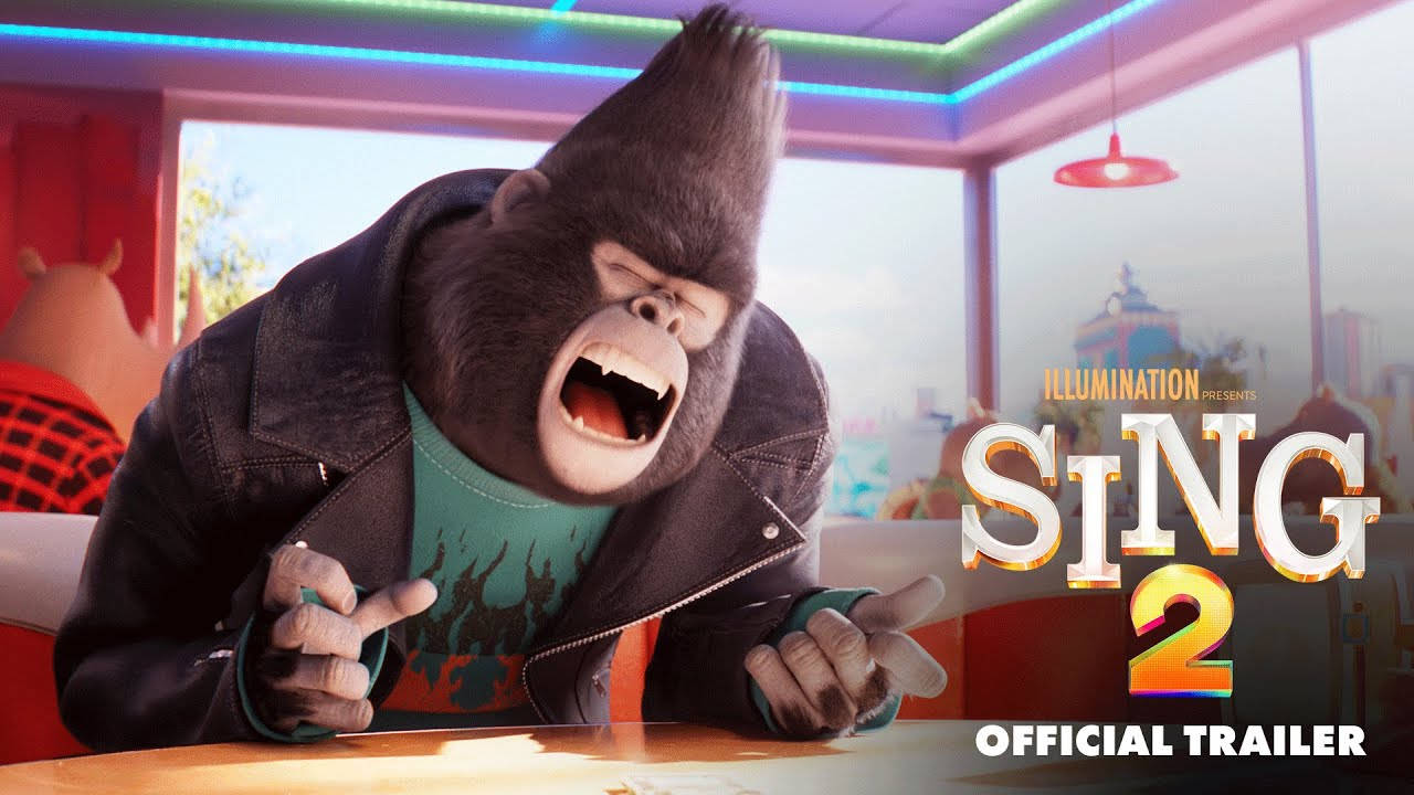 《Sing 2》中的歌手強尼 壁紙 — 一隻穿著皮褸的卡通大猩猩在霓虹燈和城市景觀的餐廳桌上熱情地尖叫。
