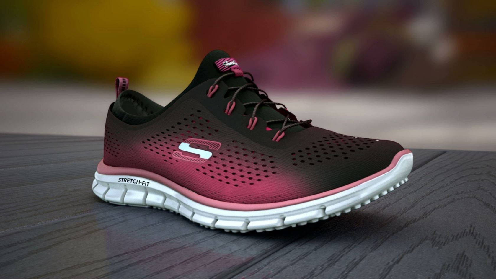 黑粉漸層 Skechers 壁紙 — 一雙時尚的黑色和粉紅色運動鞋，帶有穿孔網眼和白色鞋底，放置在深色木質表面上。
