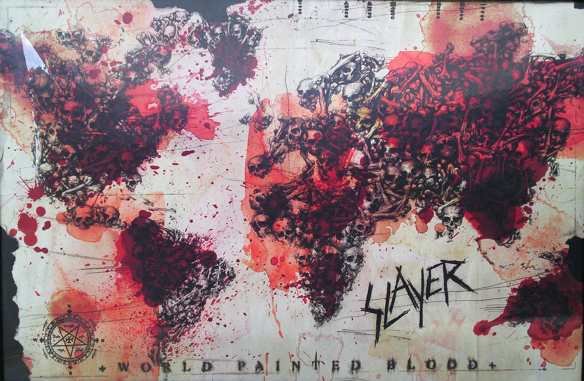覆蓋鮮血和頭骨的世界地圖，帶有 Slayer 樂隊標誌。