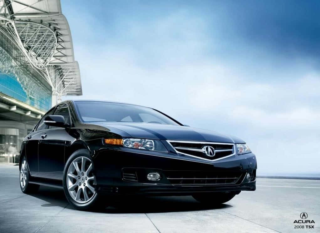 Acura Tsx 桌布 壁紙 — 一輛時尚的黑色Acura TSX轎車在明亮的日光下，在一座現代玻璃和鋼結構建築旁閃閃發光。