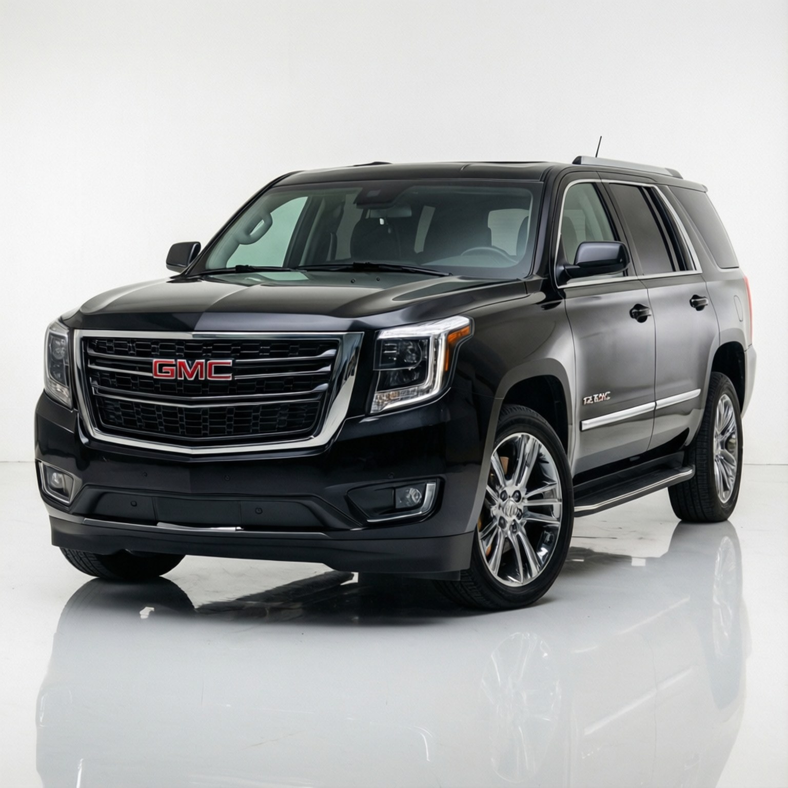 Gmc Envoy 桌布 壁紙 — 一輛時尚的黑色GMC Yukon Denali SUV在攝影棚燈光下，於反光的白色地板上閃閃發光。