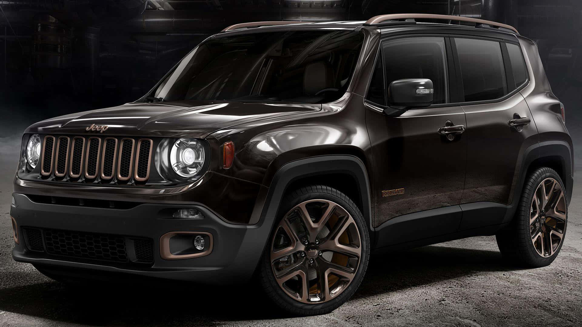 Jeep Renegade 桌布 壁紙 — 一輛時尚的深棕色Jeep Renegade帶有青銅色點綴，在戲劇性的工作室燈光下，在粗糙的混凝土地板上閃閃發光。