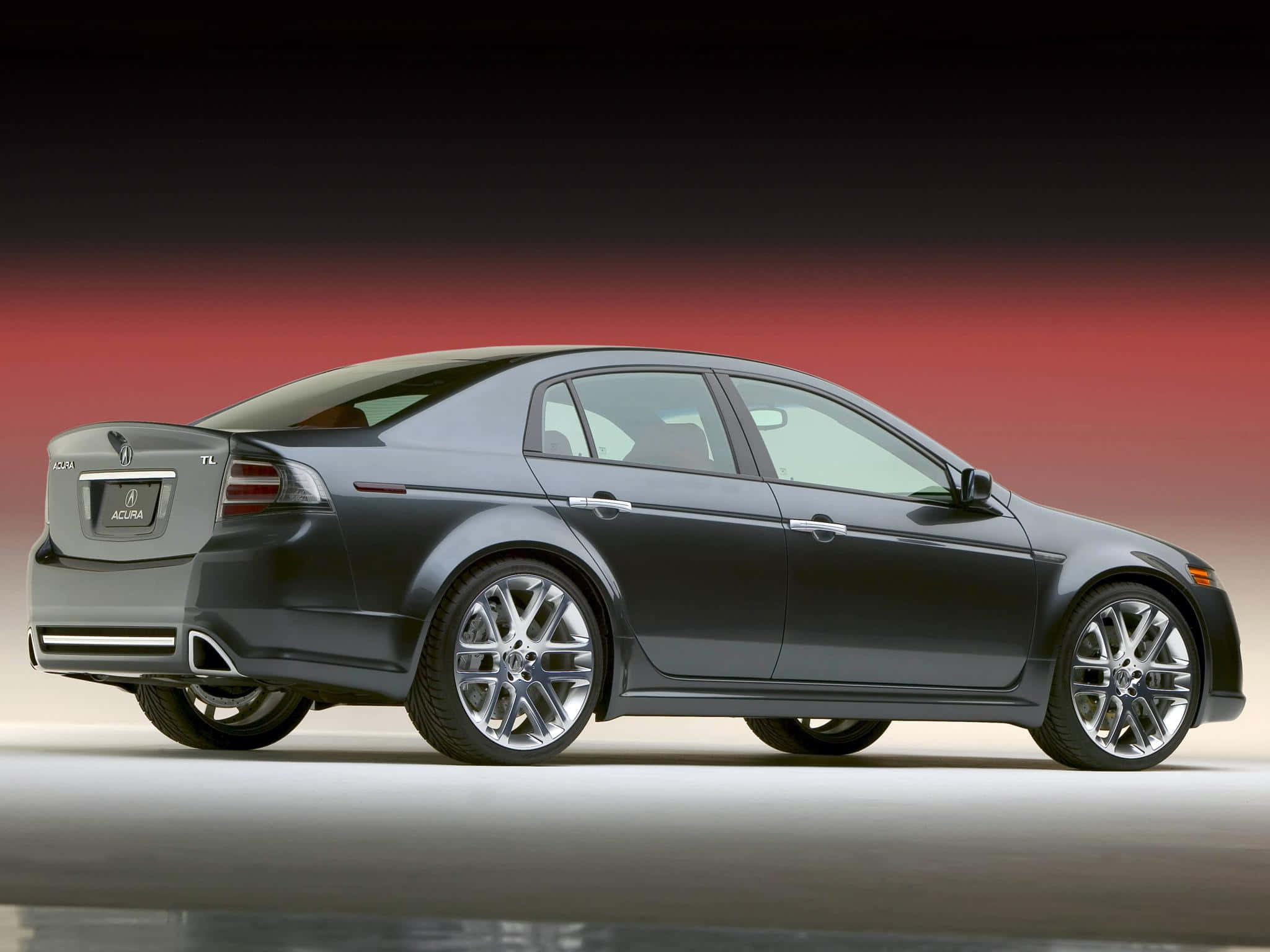 Acura Tl 桌布 壁紙 — 一輛時尚的深灰色Acura TL轎車，以側面輪廓展示在紅黑漸變的攝影棚背景前。