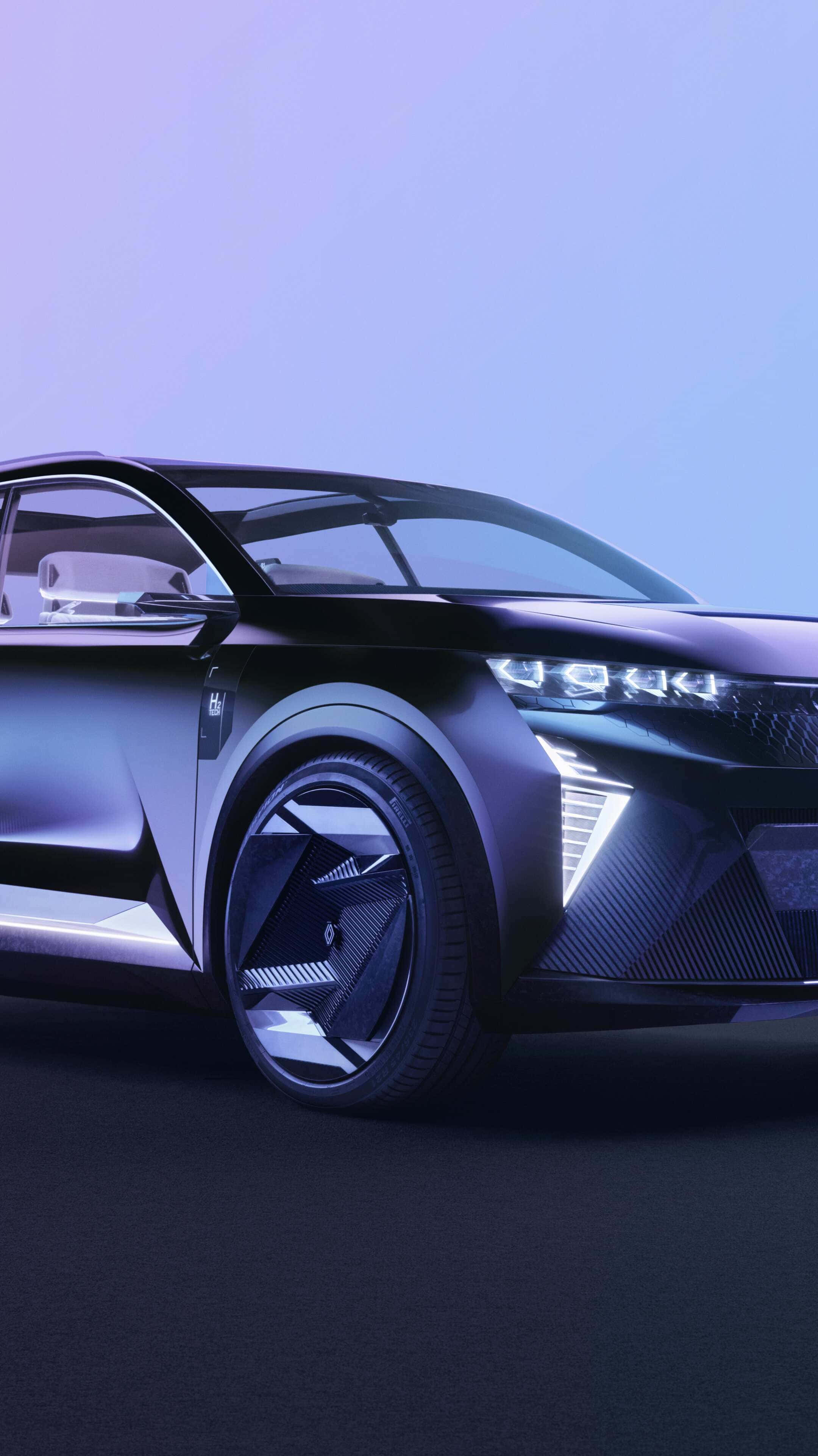 Renault Scenic 桌布 壁紙 — 一輛時尚的未來感黑色汽車，在冷紫色燈光下帶有發光頭燈和棱角設計。