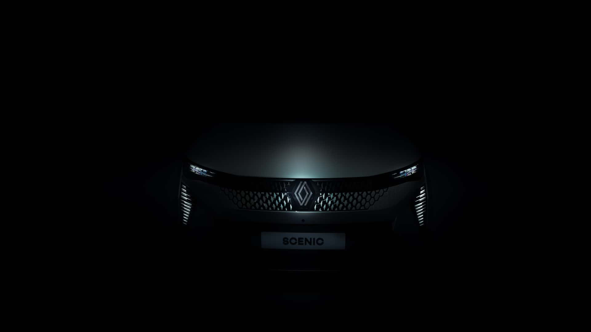 Renault Scenic 桌布 壁紙 — 一輛時尚的未來主義汽車在漆黑背景下閃爍著銳利的車頭燈。