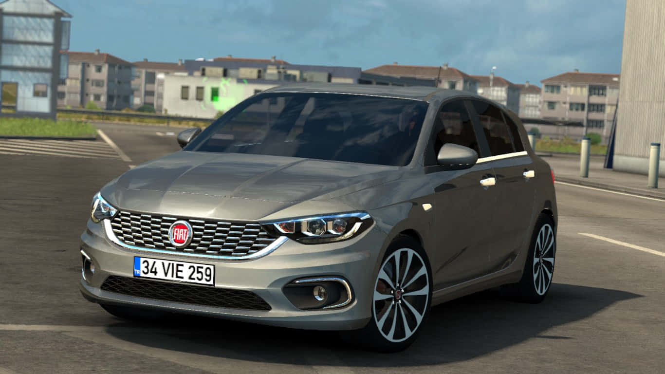 Fiat Tipo 桌布 壁紙 — 一架時尚的銀色 Fiat Punto 停泊在瀝青停車場，背景係住宅建築，天空晴朗。