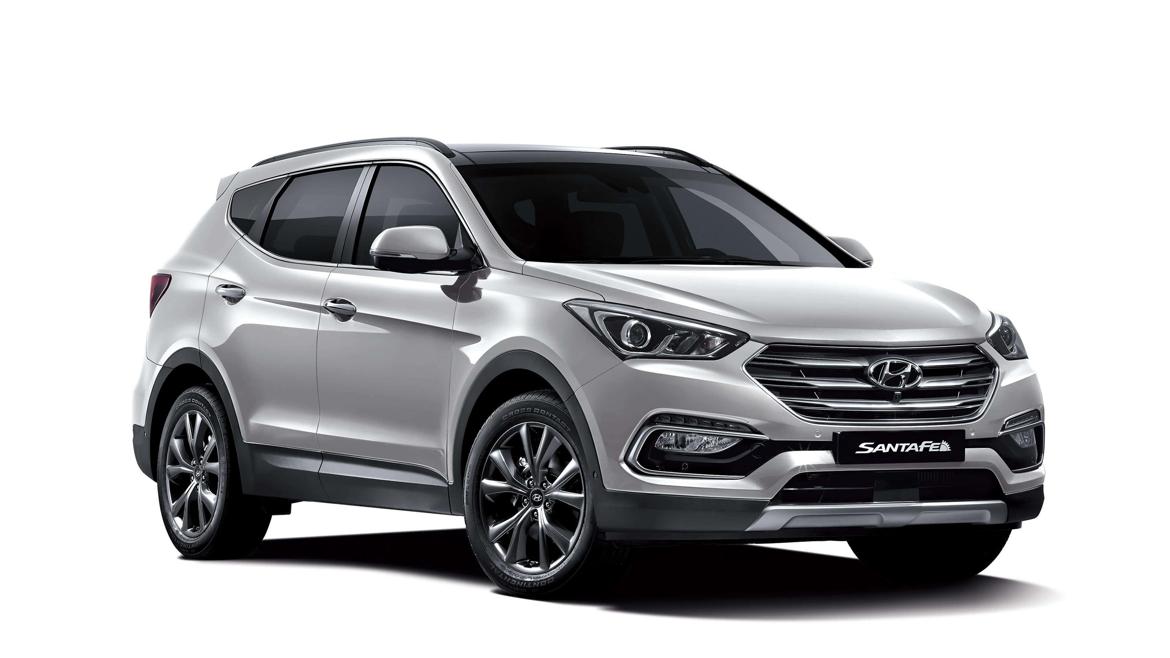 Hyundai Santa Fe 桌布 壁紙 — 一輛時尚的銀色現代Santa Fe SUV在乾淨的攝影棚拍攝中展示，具有銳利的燈光和反射表面。