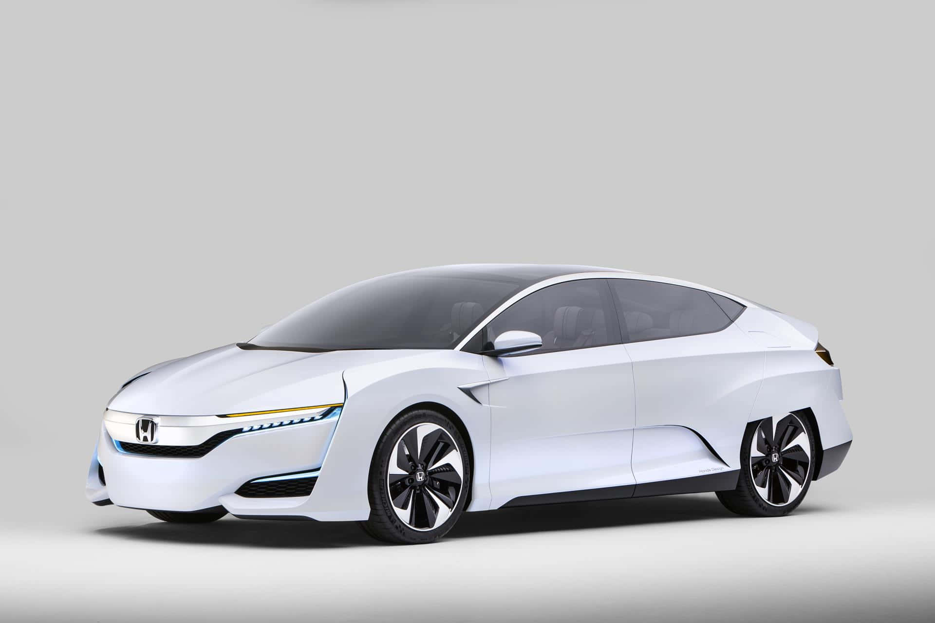 Honda Clarity 桌布 壁紙 — 一款時尚的白色未來感本田概念車，帶有發光藍色飾邊和空氣動力學設計，以簡約灰色工作室背景襯托。