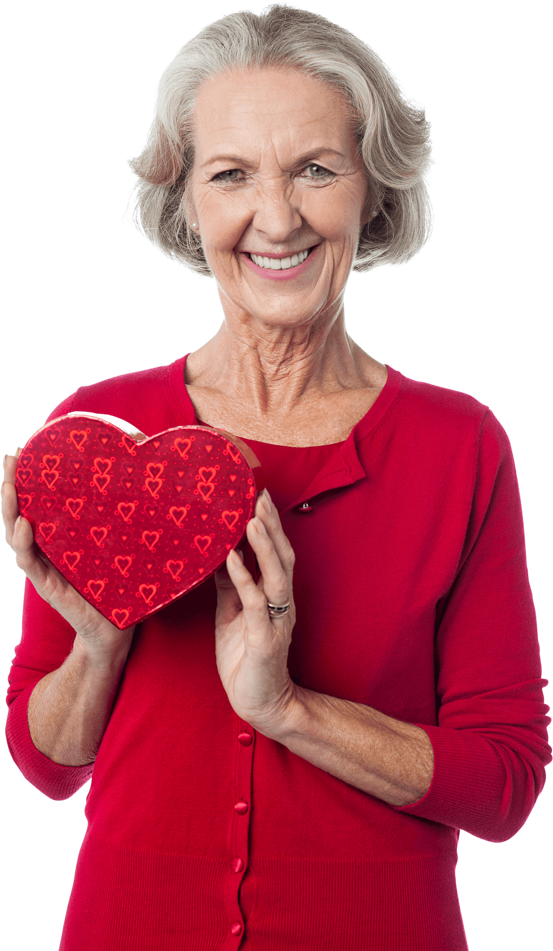 Smiling Grannywith Heart Shaped Box 壁紙 — 一位灰髮老婦人微笑著，手持一個裝飾著小愛心的紅色心形盒子。
