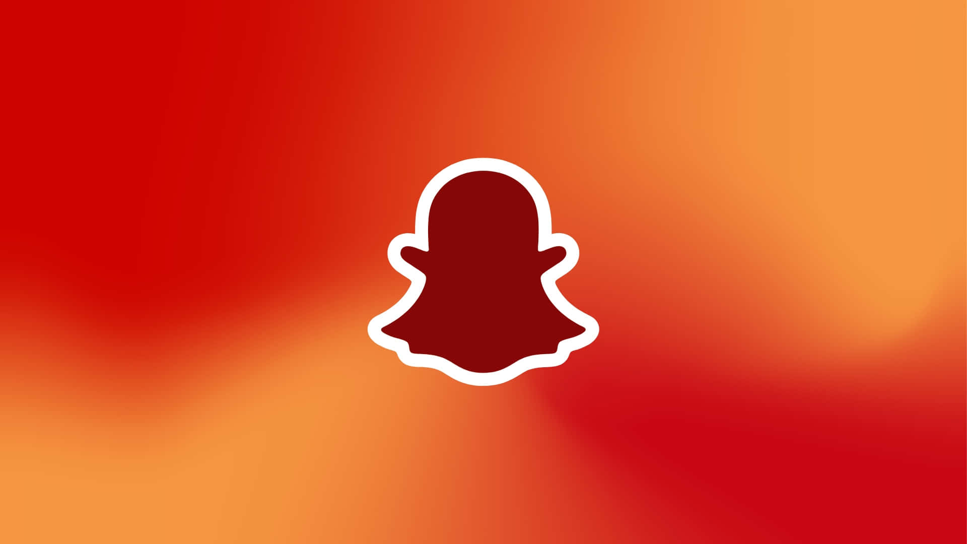  壁紙 — 一個白色輪廓的Snapchat鬼魂標誌漂浮在充滿活力的紅到橙漸變背景上。