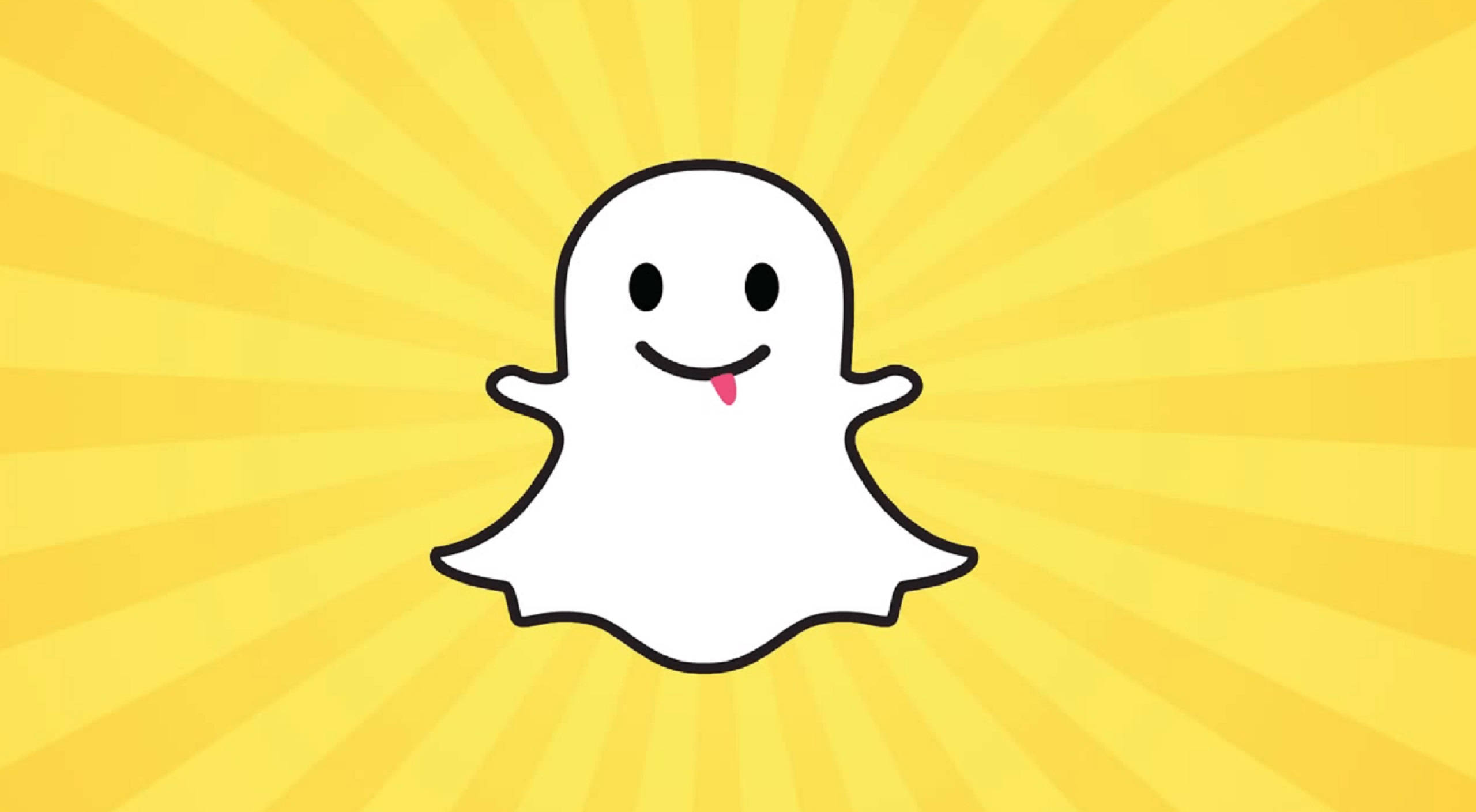 Snapchat幽靈復古藝術 壁紙 — 一個快樂的卡通鬼魂伸出粉紅色舌頭，在明亮的黃色太陽光背景下突出。