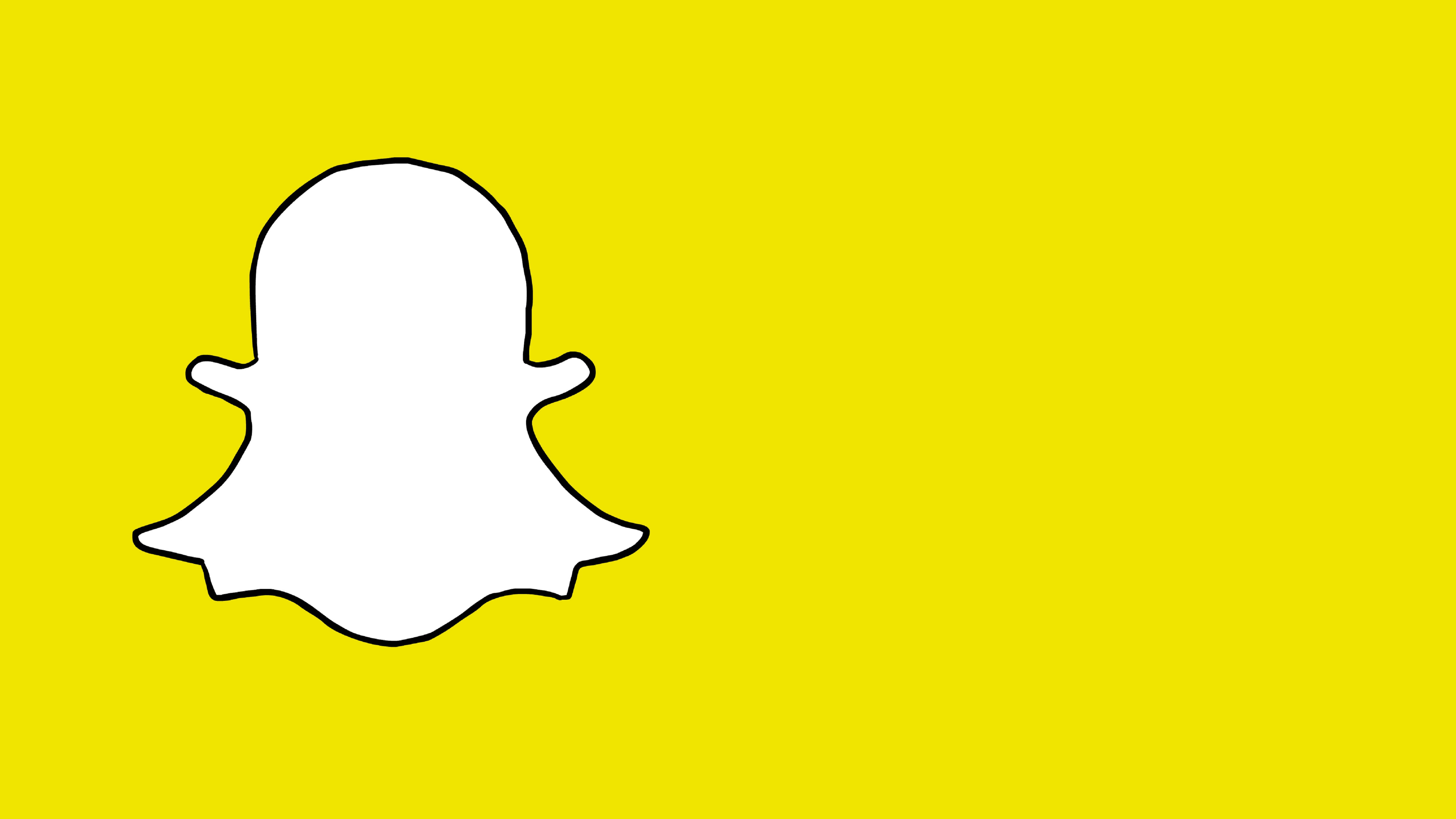 Snapchat標誌空間 壁紙 — 一個極簡風格的白色 Snapchat 鬼魂標誌，以黑色輪廓勾勒在純亮黃色背景上。
