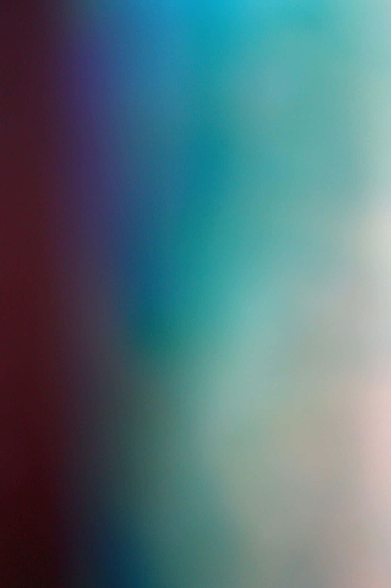 colors 桌布 壁紙 — 從深紅色到藍綠色的柔和漸變，加上微妙的白色高光，營造出夢幻般的抽象背景。