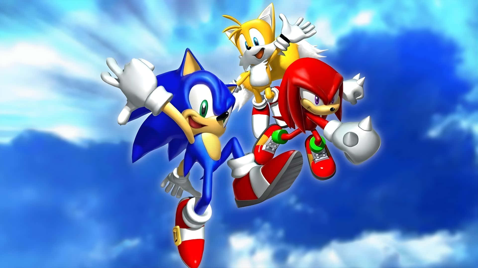  壁紙 — Sonic Tails 和 Knuckles 在明亮的藍天中翱翔，身後有蓬鬆的白雲。