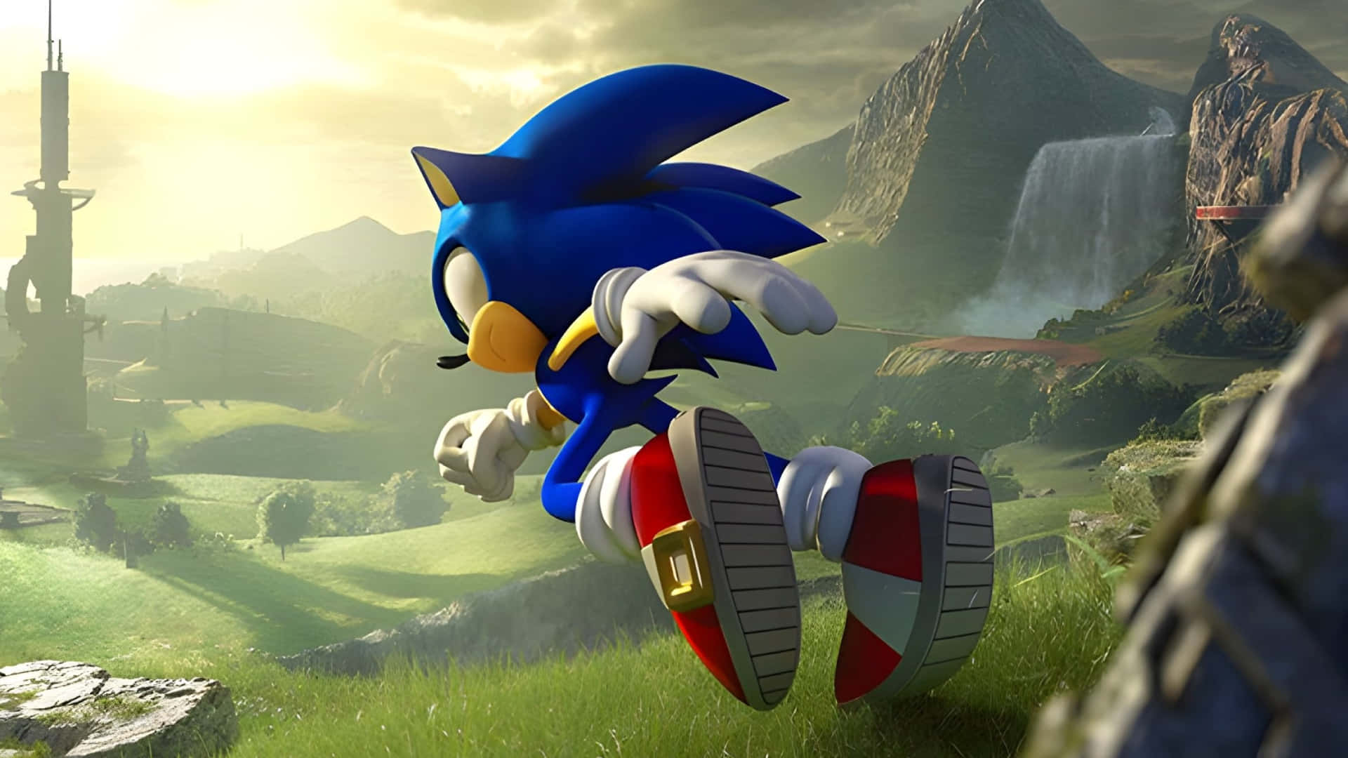 Sonic The Hedgehog Characters 桌布 壁紙 — Sonic the Hedgehog 喺陽光照耀嘅草地上疾馳而過，背景有山脈、瀑布同古代遺跡。