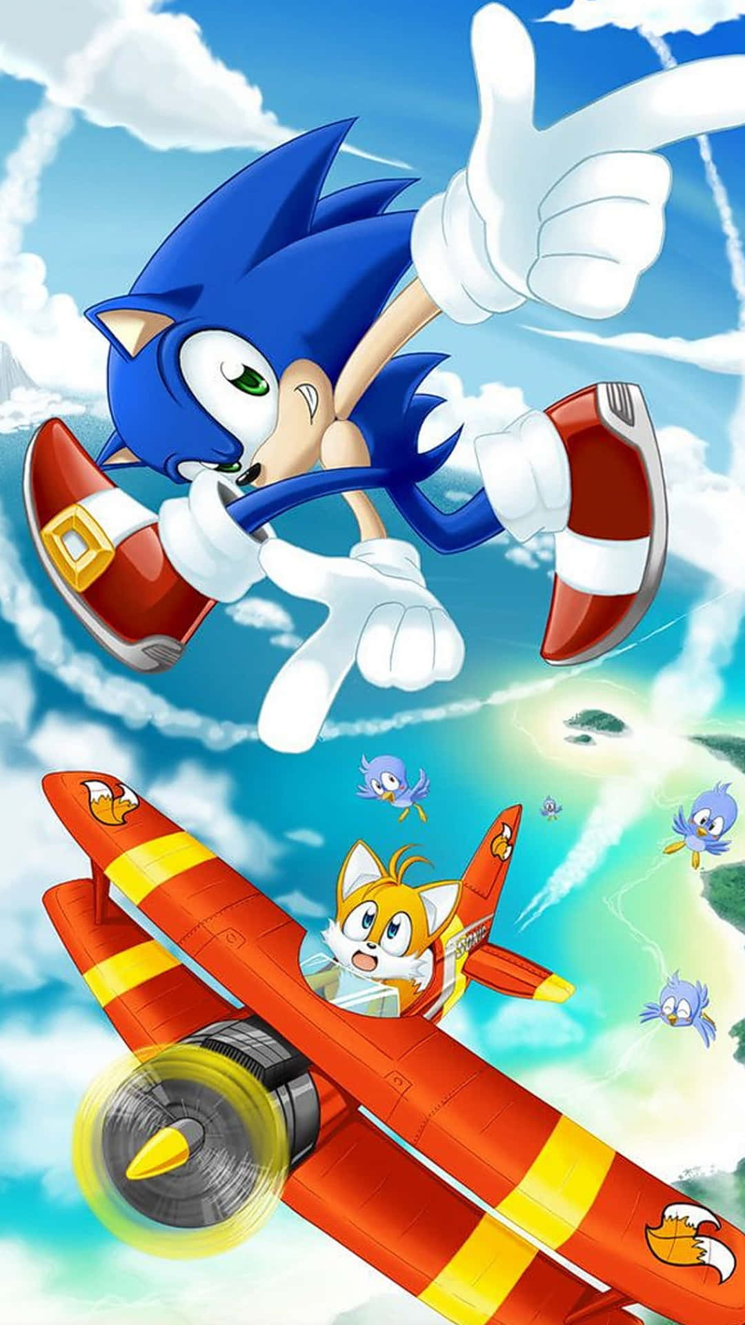Sonic Adventure HD 桌布 壁紙 — Sonic the Hedgehog 喺晴朗藍天同 fluffy 雲朵背景下，飛喺 Tails 嘅紅色雙翼機上面豎起拇指。