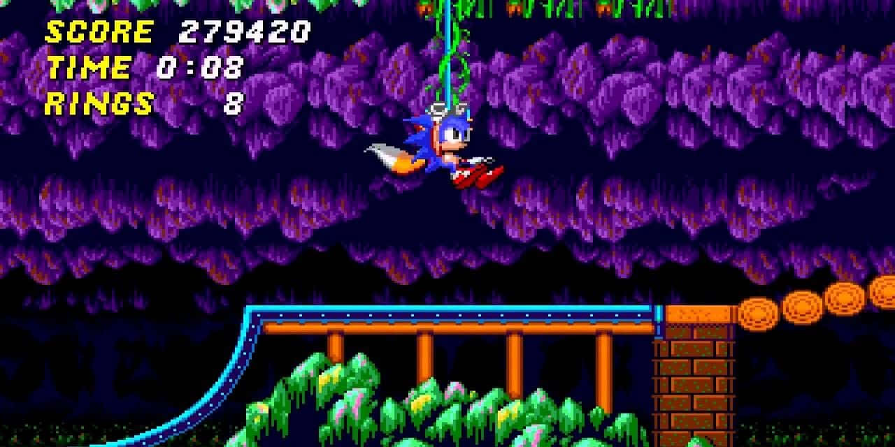  壁紙 — Sonic the Hedgehog 掛在一條藤蔓上，身處一個像素化的綠色和紫色洞穴，下方有藍色管道和橙色圓環。