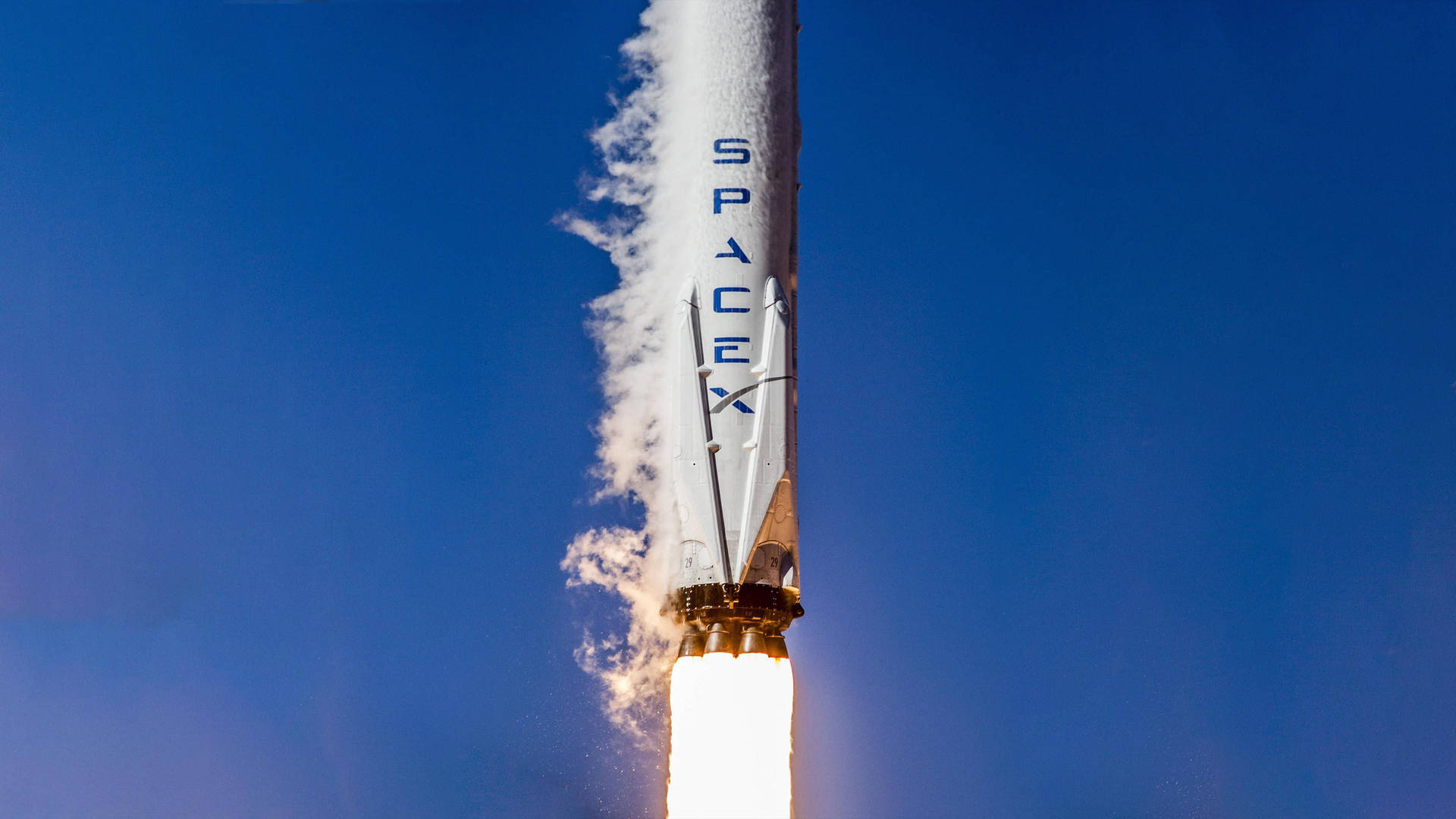 SpaceX 火箭發射至藍天，帶有熾熱尾焰 — Spacex GIF 壁紙
