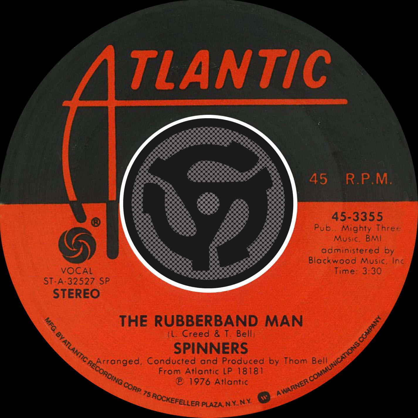 Spinners《橡皮筋男人》專輯碟 壁紙 — The Spinners 的《The Rubberband Man》的復古 Atlantic Records 45 RPM 黑膠唱片標籤，帶有醒目的橙色和黑色字體。