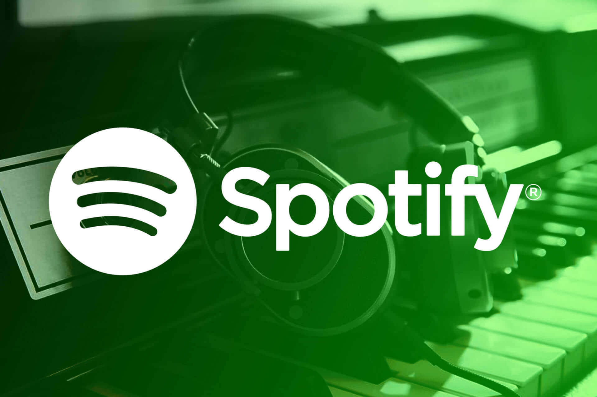 Spotify - 綠色背景配上耳機與鋼琴 壁紙