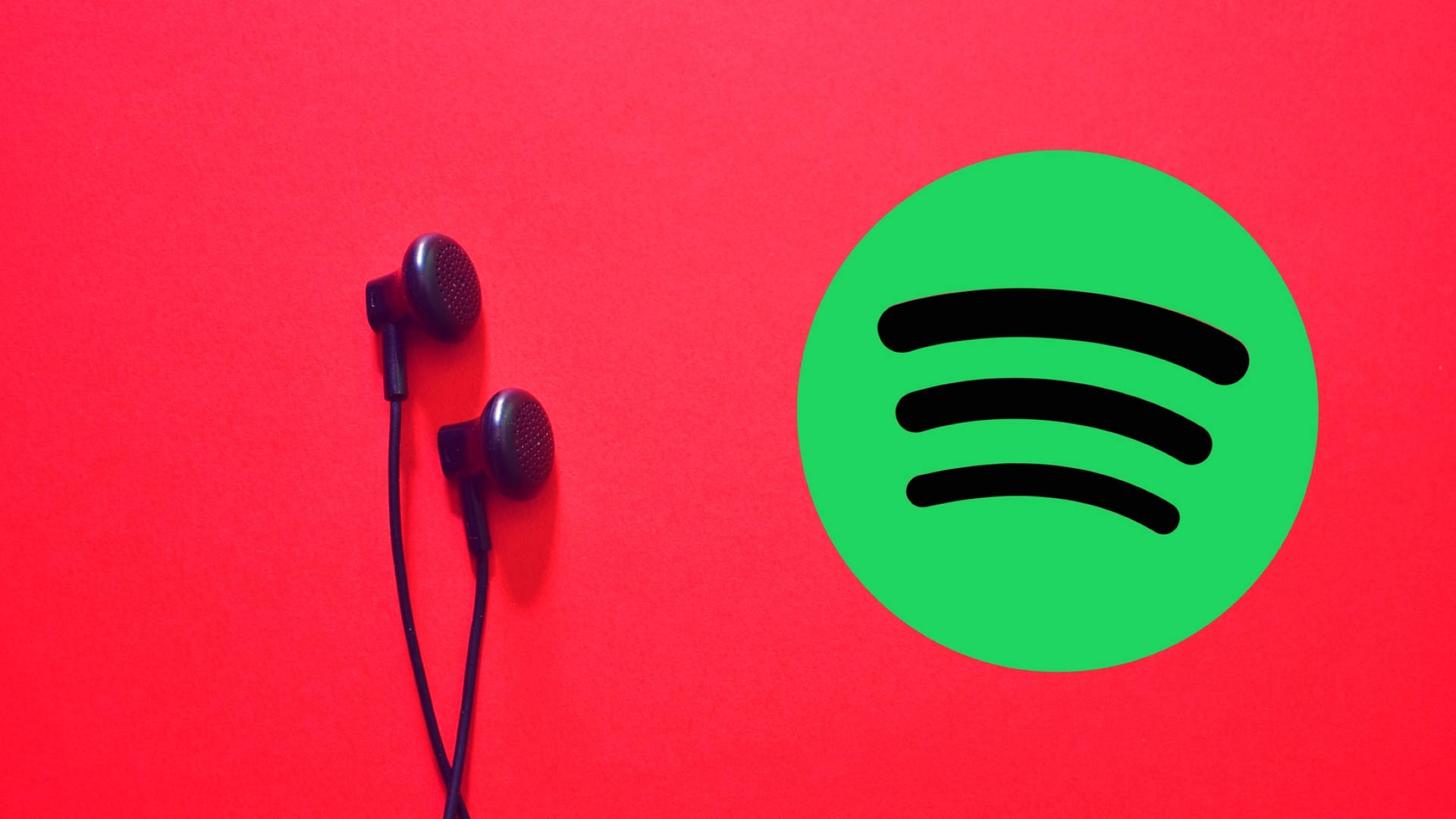 黑色耳機在紅色背景上與Spotify標誌相鄰