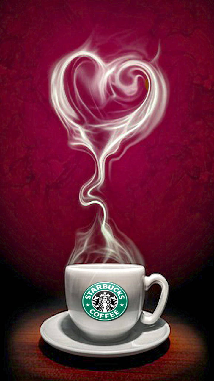 Starbucks咖啡杯，心形蒸氣從中升起，放在木桌上。 — 星巴克 壁紙