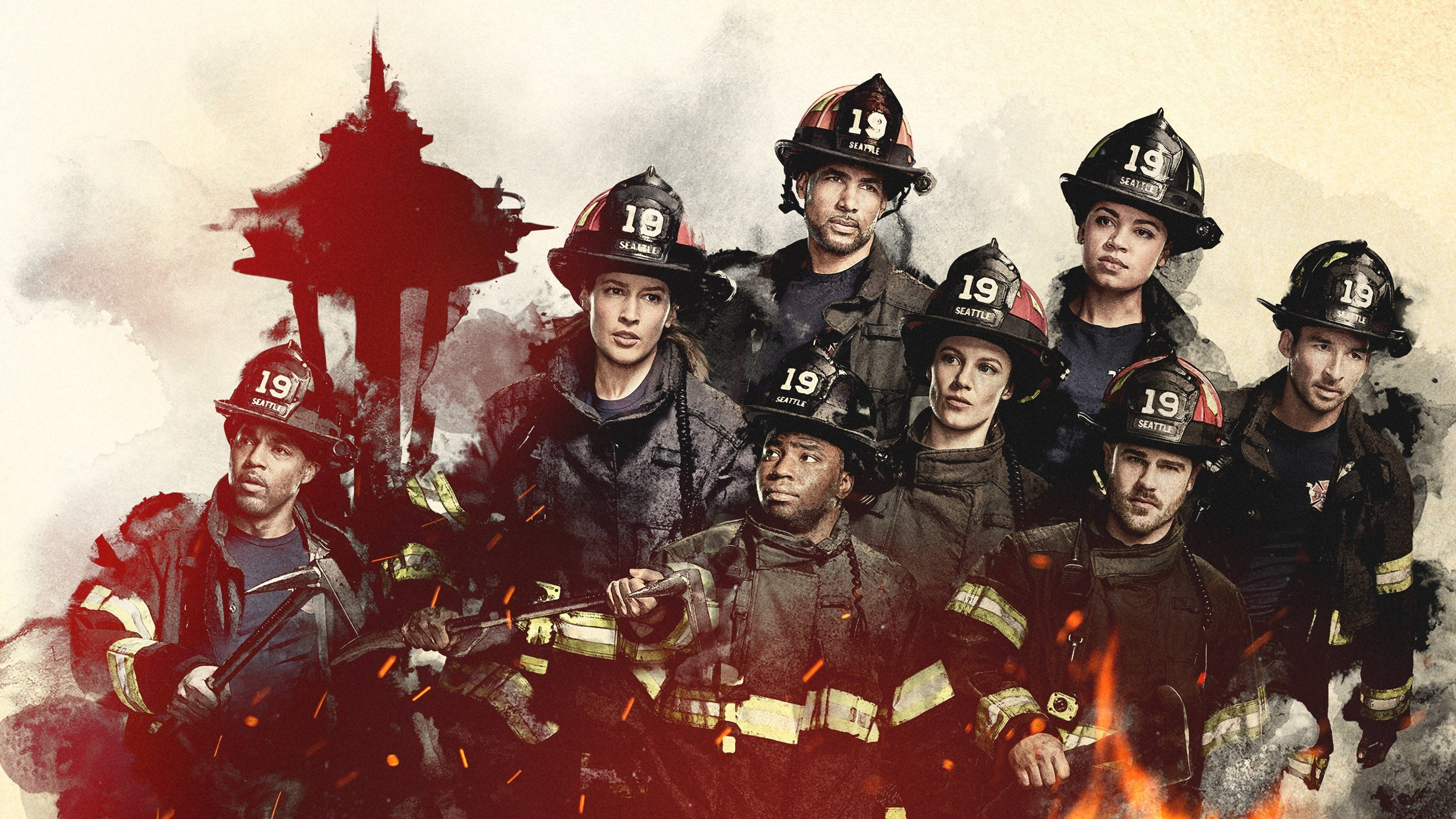 《Station 19》英勇消防員行動畫面 壁紙 — 一群身穿裝備的消防員在煙霧和火焰的背景下堅定地站立，太空針塔部分可見於他們身後。