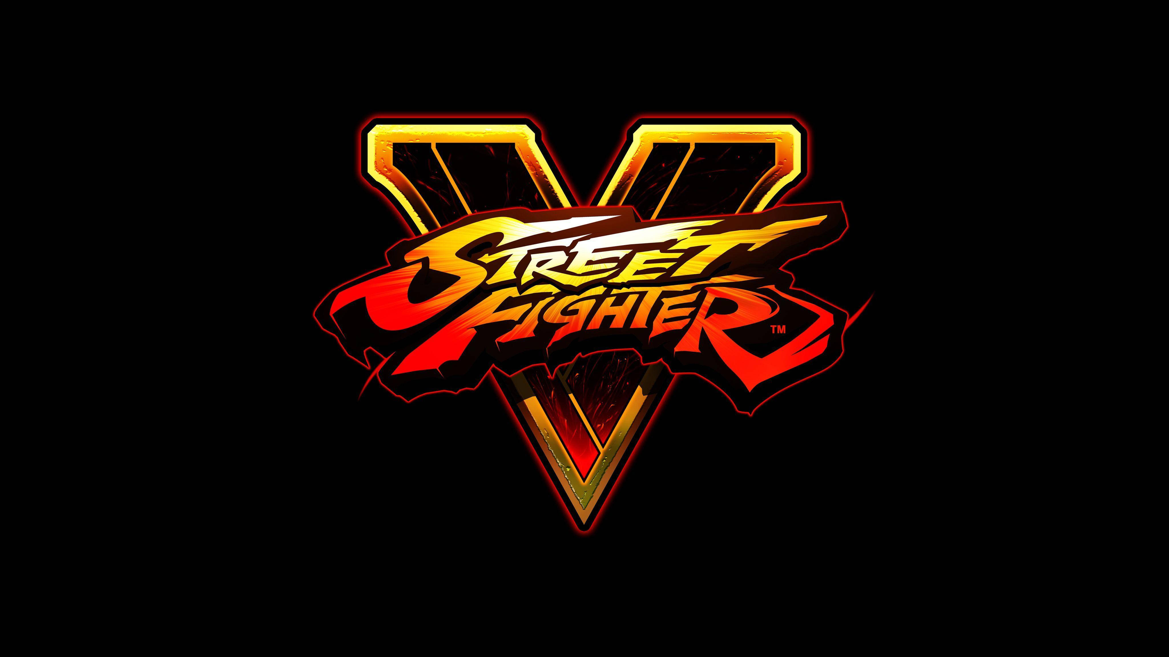 Street Fighter V遊戲標誌 壁紙 — Street Fighter V 標誌在純黑背景上閃耀著火紅與金色的光芒。
