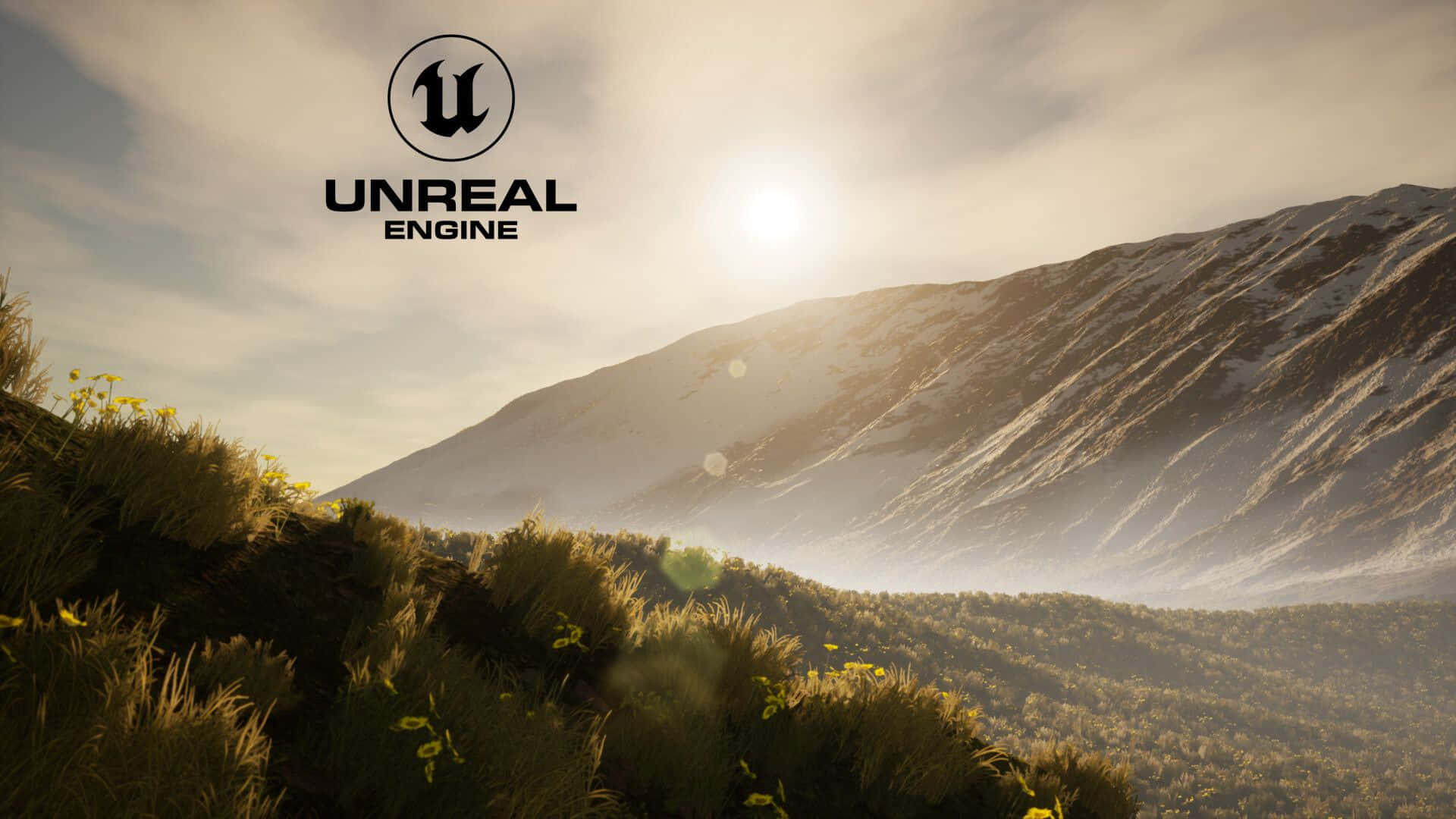 壁紙 — 陽光照射在積雪的山脈上，前景有金色的草叢，並可見 Unreal Engine 標誌。