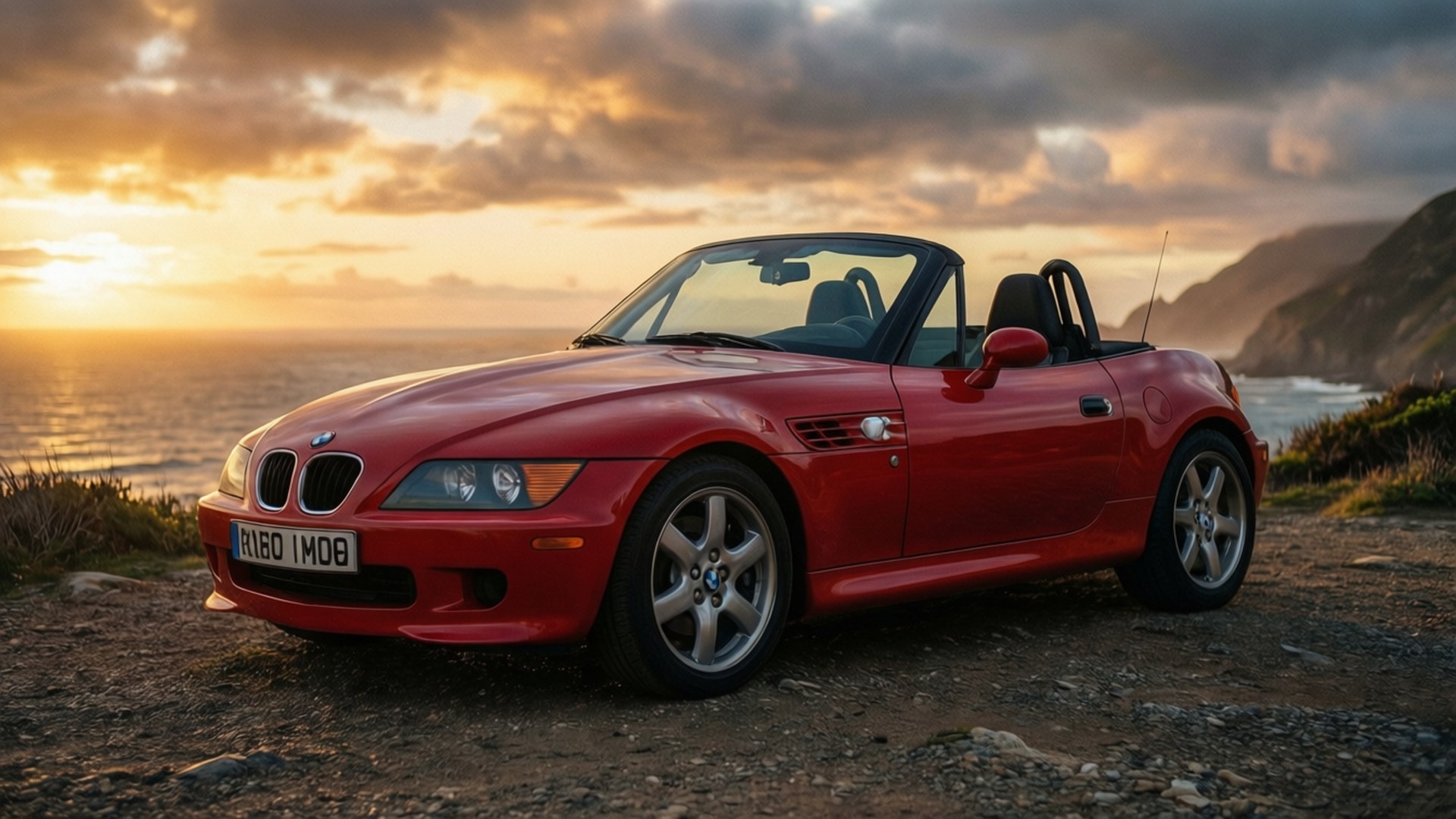 紅色BMW Z3開篷車停在俯瞰大海的懸崖上，正值日落時分。