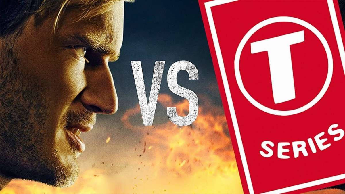 男人對抗帶火焰背景的T Series標誌