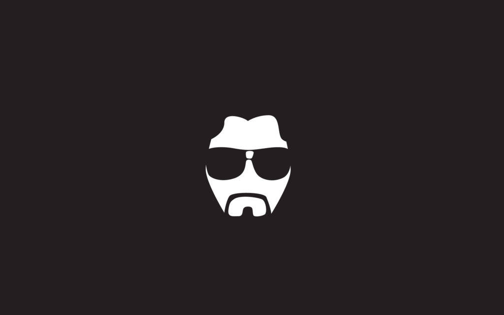 The Dude 壁紙 — 一個戴太陽眼鏡和山羊鬍鬚的男人的極簡白色剪影，居中在深色背景上。