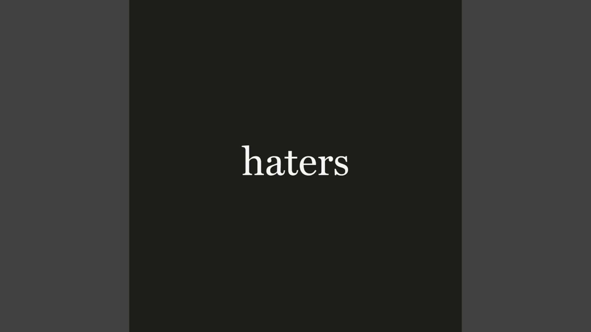  壁紙 — 「haters」一詞以白色襯線字體居中顯示在深色漸變背景上。