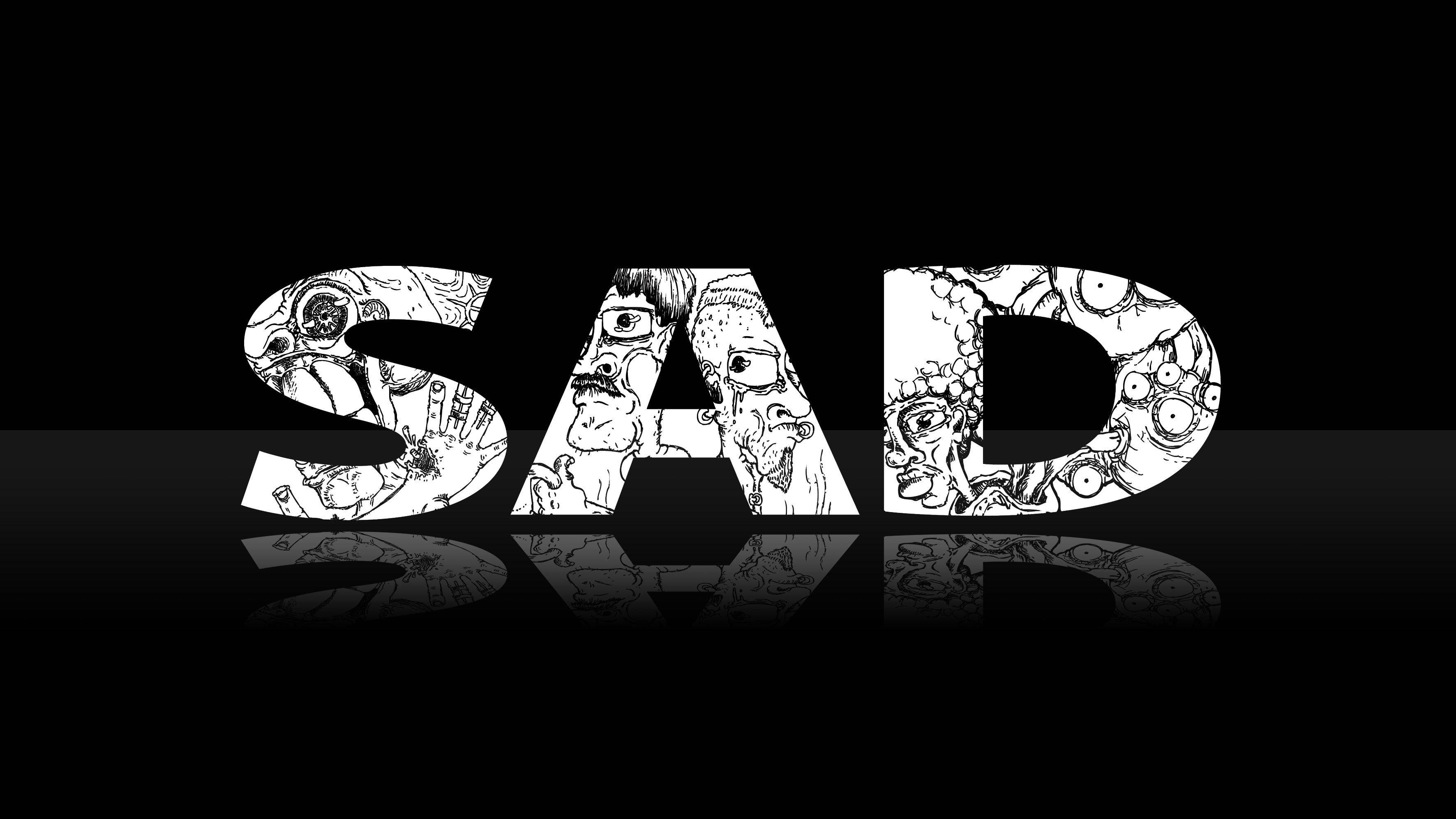 「人生有時就是如此憂鬱。」 壁紙 — 黑色反光表面上，粗體字「SAD」填滿了怪誕的卡通面孔。