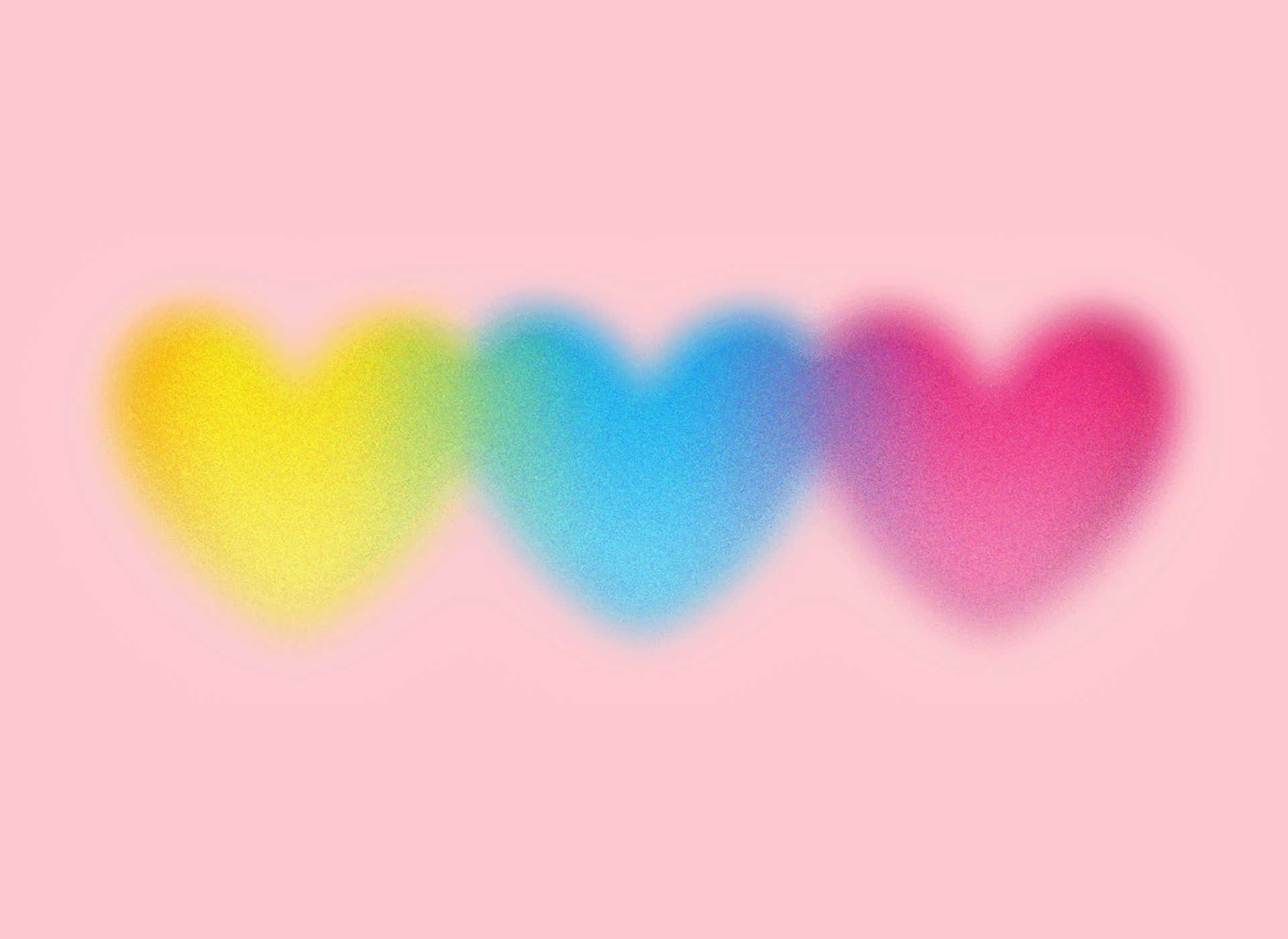 三個色彩繽紛的模糊心形在柔和的粉紅色背景上 — 粉紅色心形動圖 壁紙