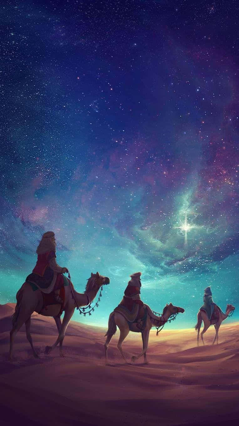  壁紙 — 三位騎著駱駝的旅人在充滿活力的星空下穿越沙漠，一顆明亮的指路星照耀著他們。