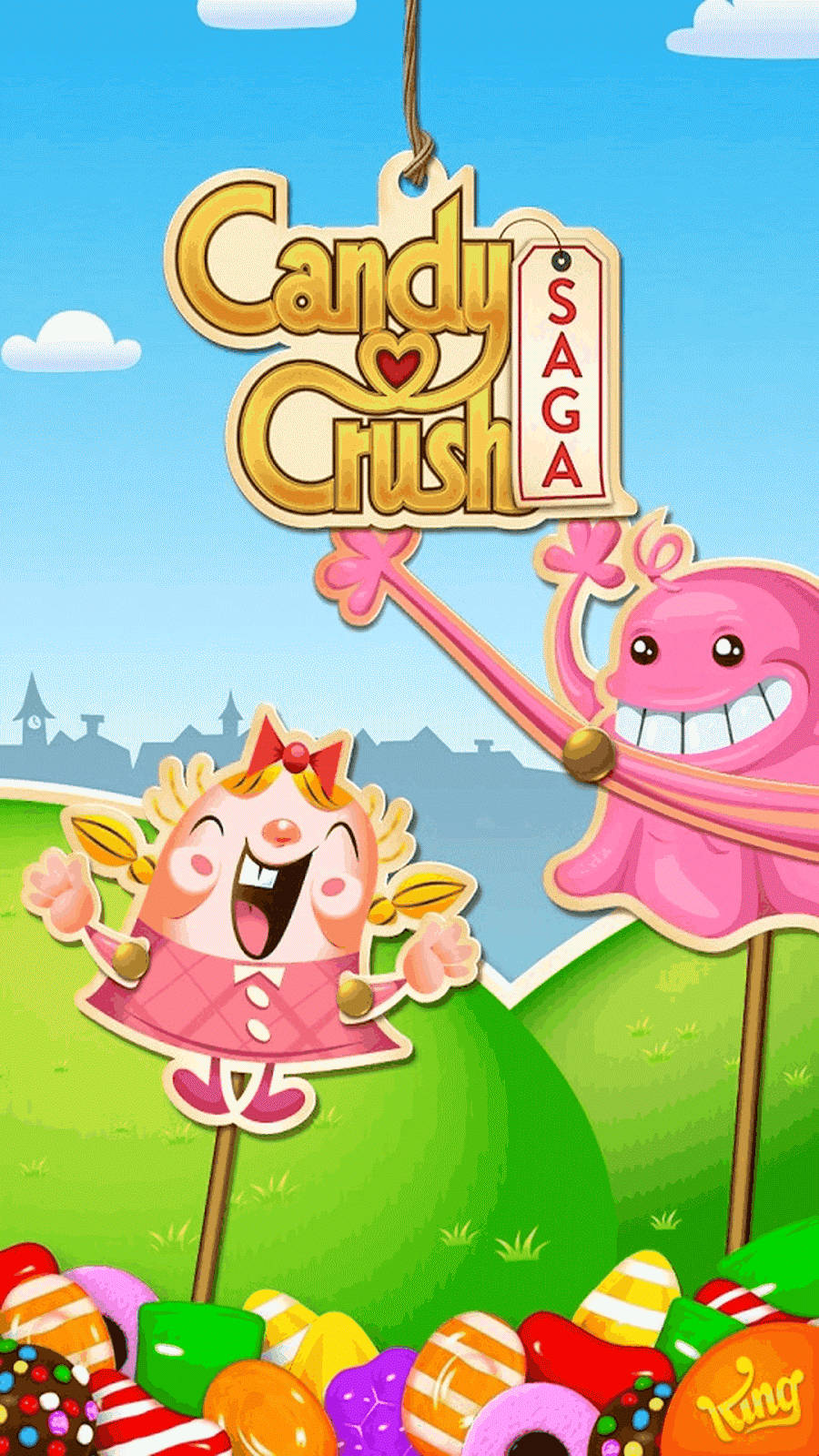Candy Crush Saga 遊戲角色在色彩繽紛的糖果景觀中。