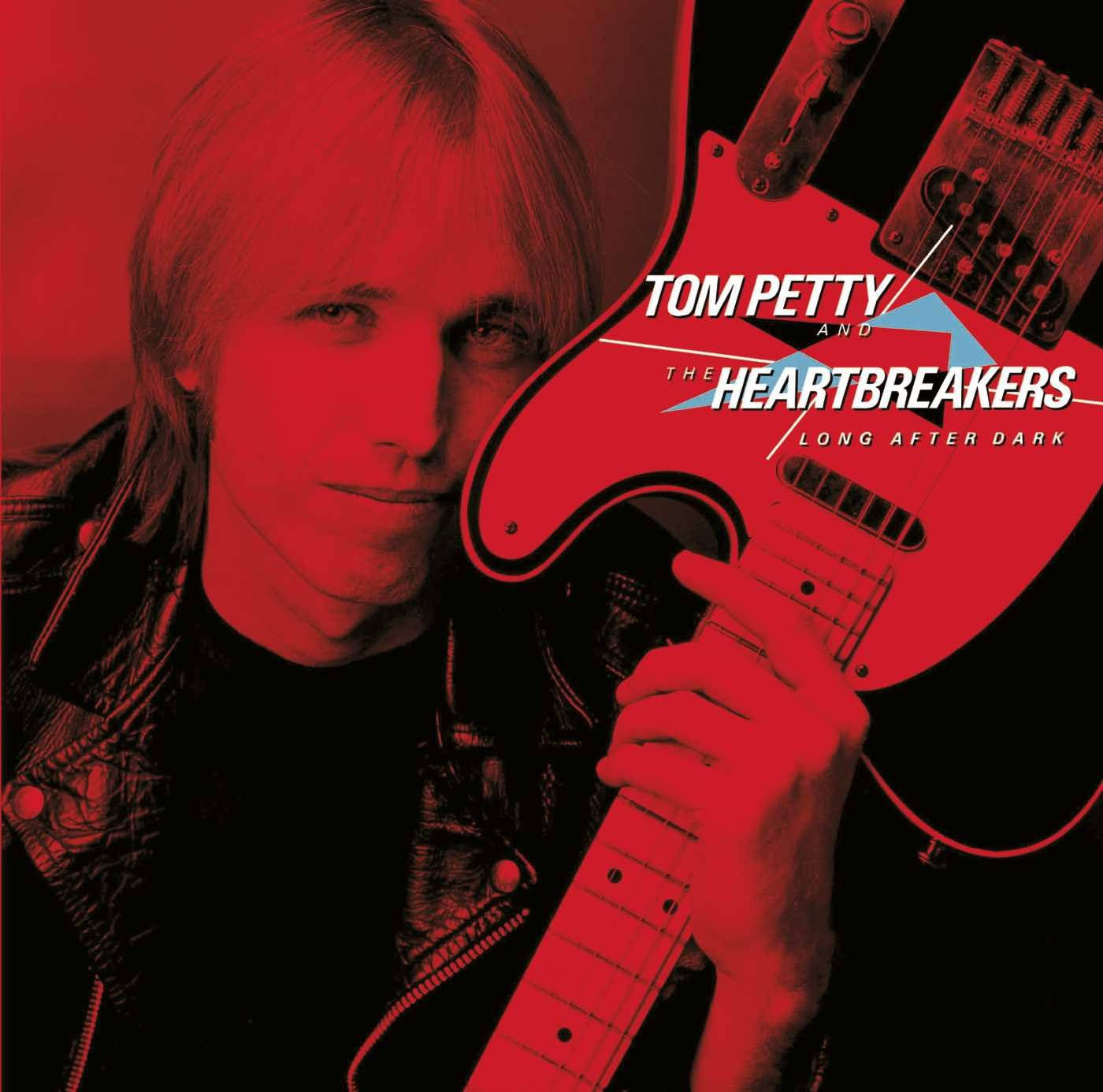 Tom Petty 在紅色背景上手持紅色電結他，並有專輯文字。