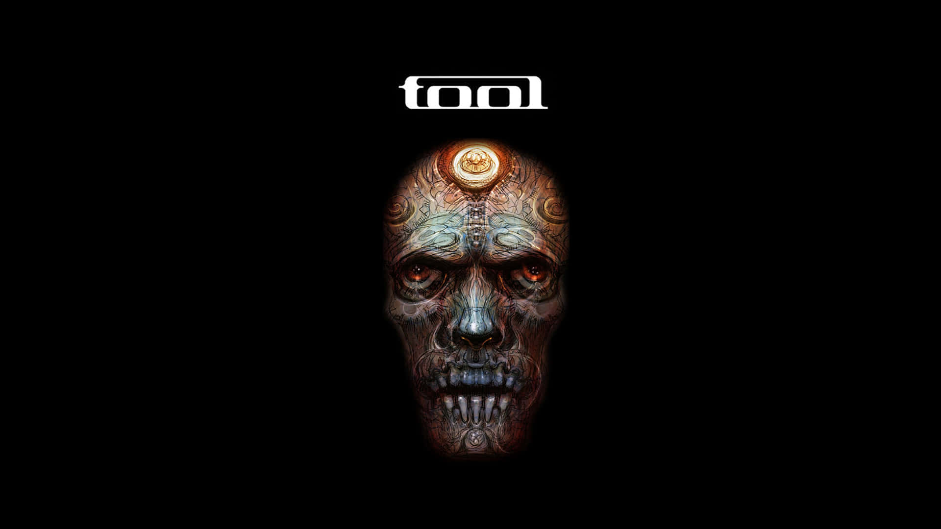 一個風格化的頭骨，帶有發光的眼睛和複雜的設計，上方有「tool」一詞。