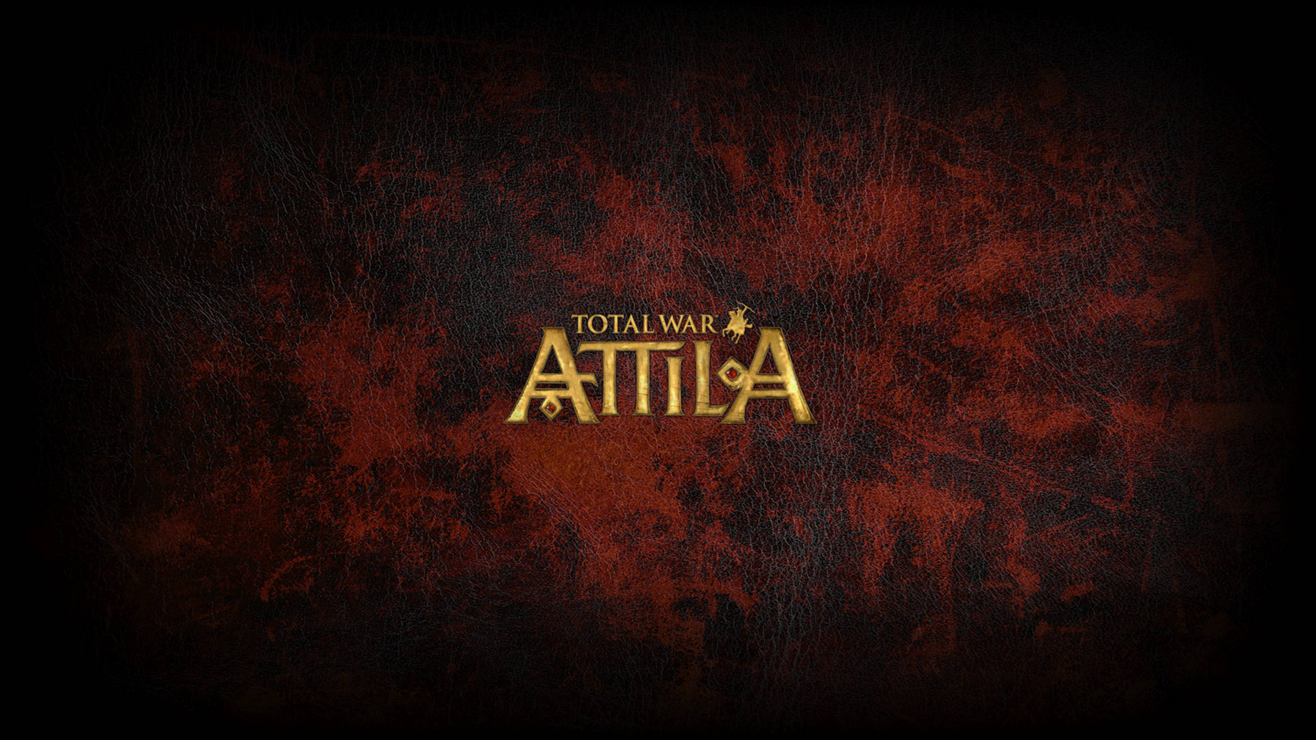 Total War: Attila 金與血 壁紙 — 金色嘅 'Total War ATTILA' 標誌喺深色紋理紅色皮革背景上閃耀，帶有細微嘅刮痕同磨損。