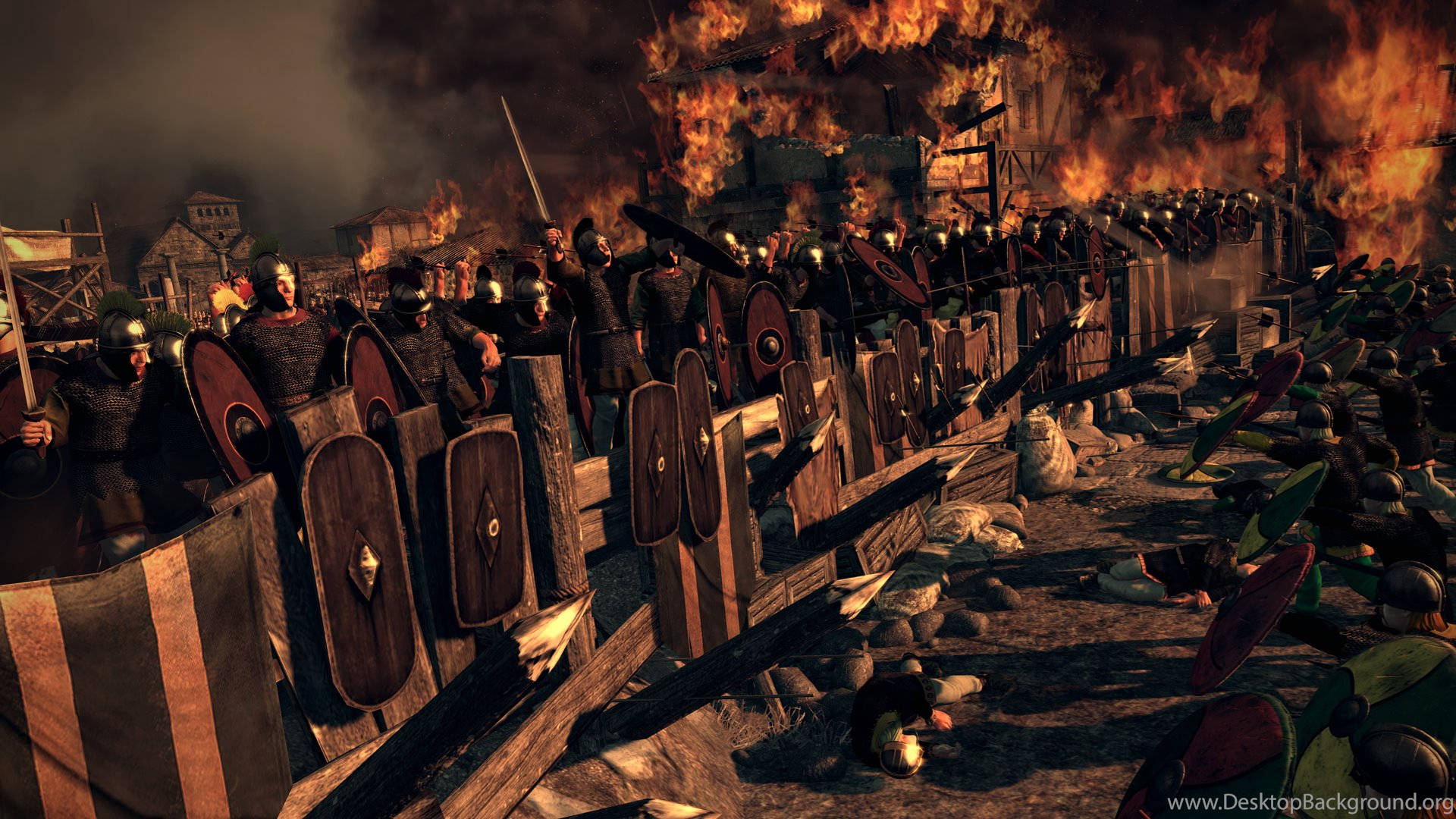 Total War: Attila 防禦工事 壁紙 — 身穿盔甲的羅馬軍團士兵在圍城期間，於燃燒的建築物和混亂中形成盾牆。