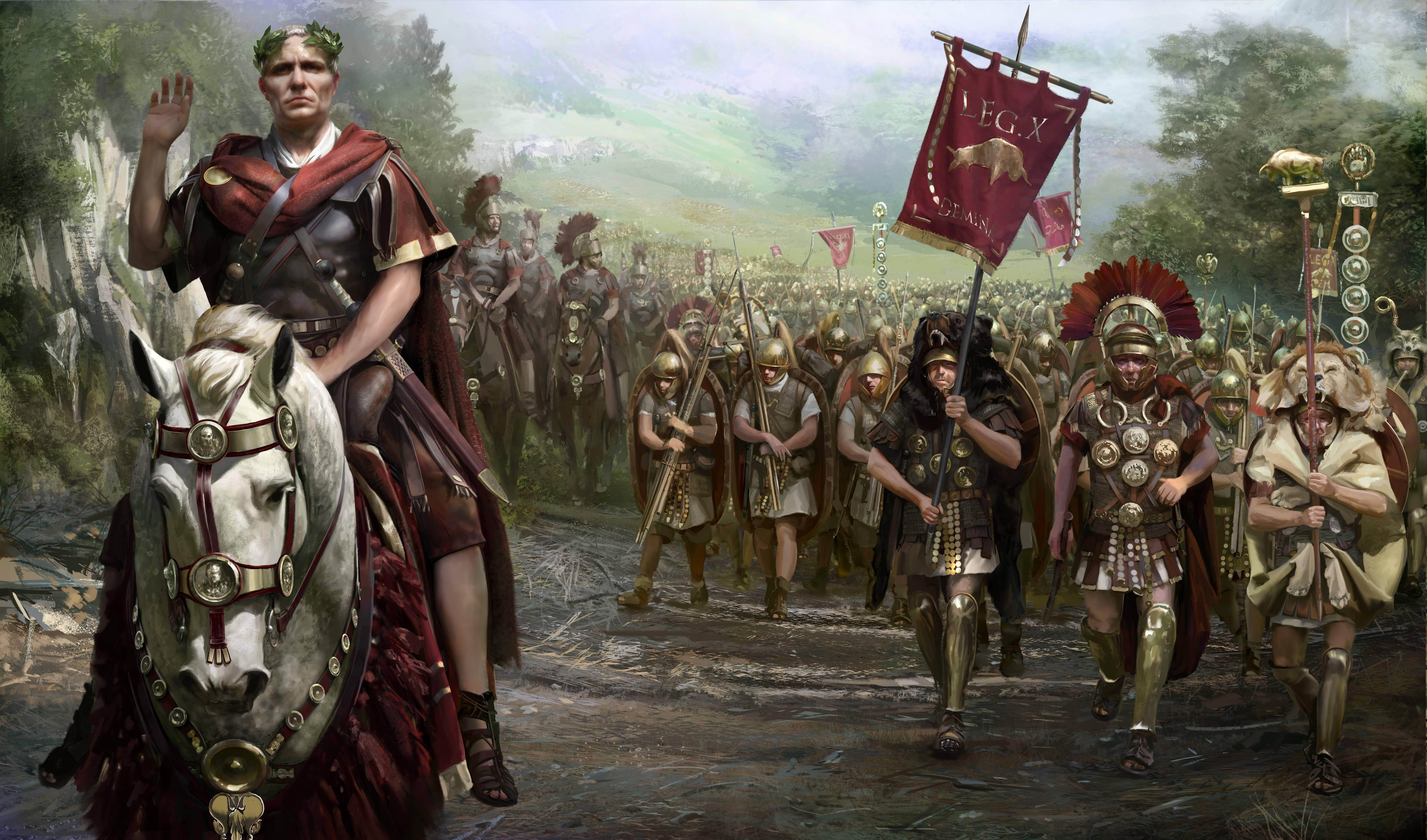 Total War 羅馬軍團 壁紙 — 一位羅馬將軍騎著白馬，帶領他的軍團穿過森林山谷，士兵們在他身後行進。