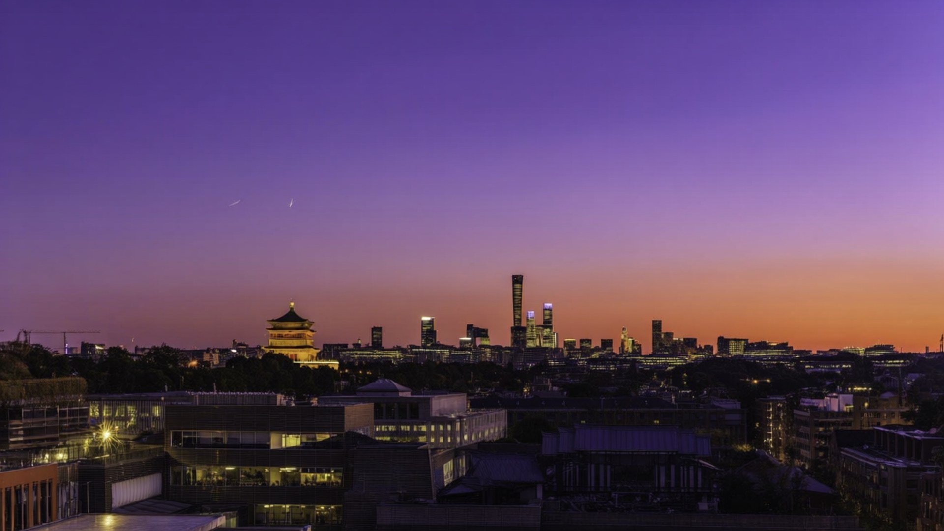 暮色城市天際線，紫色橙色天空，發光建築包括寶塔