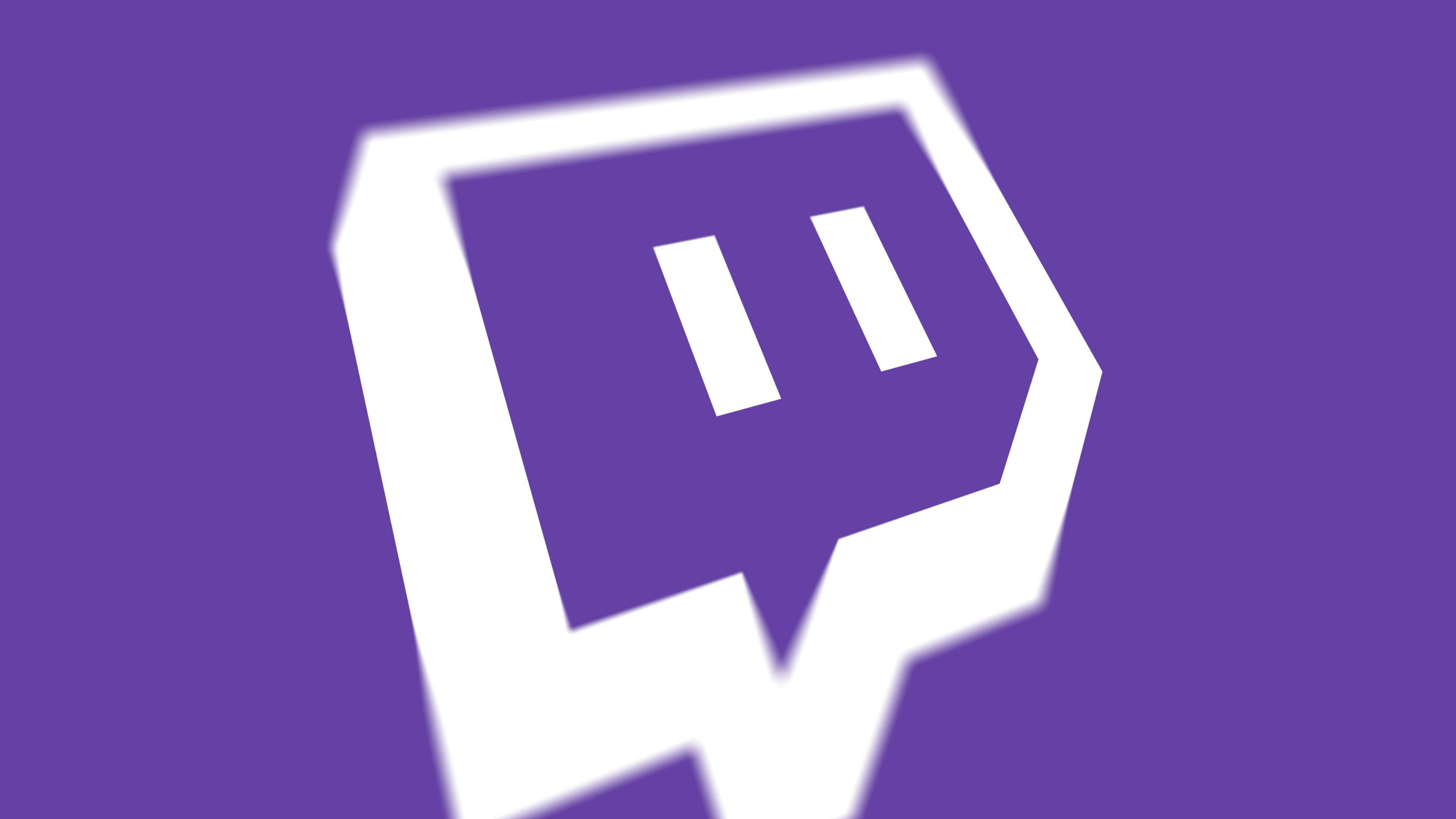Twitch 聊天框圖標 壁紙 — 一個大膽的白色 Twitch 標誌居中在純紫色背景上，帶有柔和漸變模糊效果。