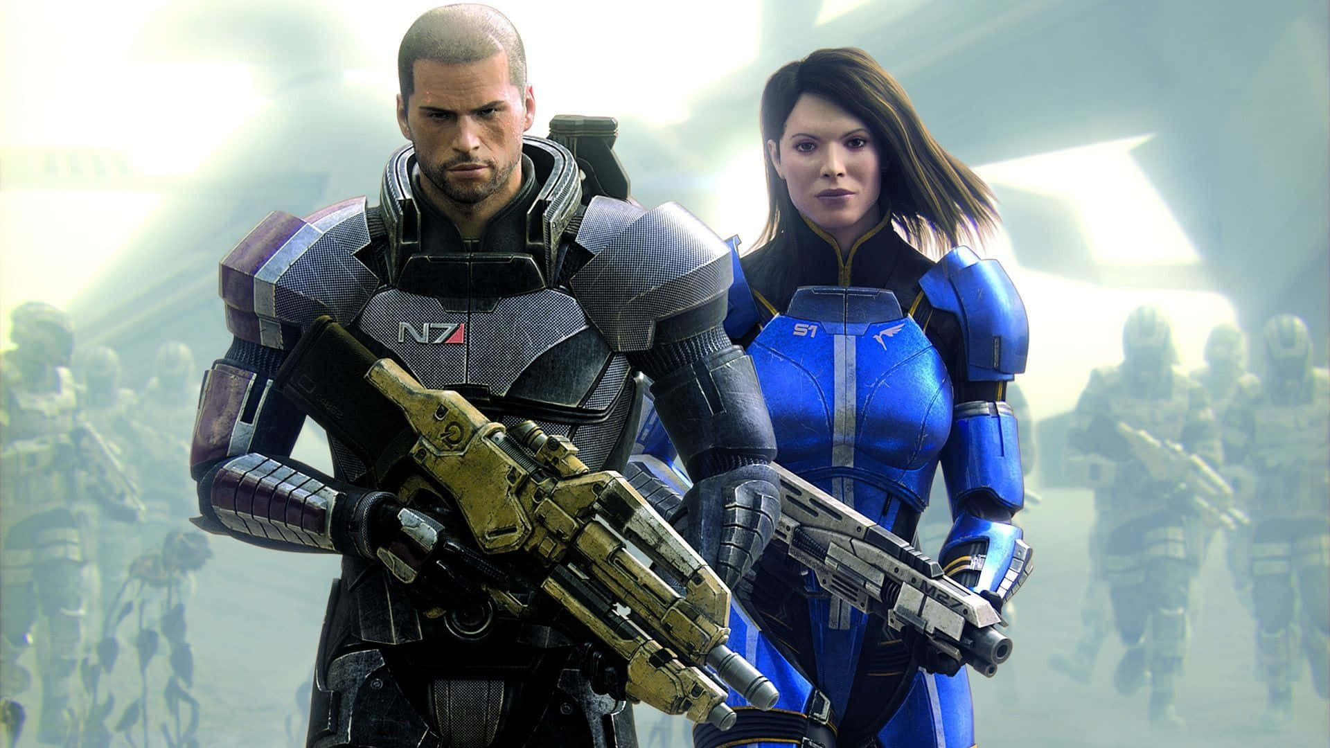 Mass Effect Legendary Edition 桌布 壁紙 — 兩名身穿裝甲的科幻士兵在朦朧的未來戰場上手持武器準備就緒。
