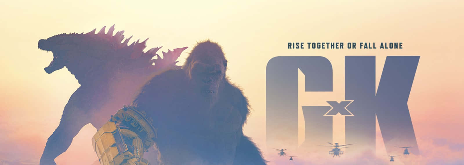 Godzilla X Kong The New Empire 桌布 壁紙 — 兩隻巨大的怪獸哥斯拉和金剛站在發光的日落背光下，直升機在下方飛行。