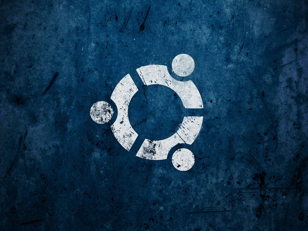 Ubuntu 標誌以白色繪製在破舊的藍色牆壁上。